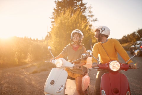 Tourits with vespas exploring Sanremo City in Italy