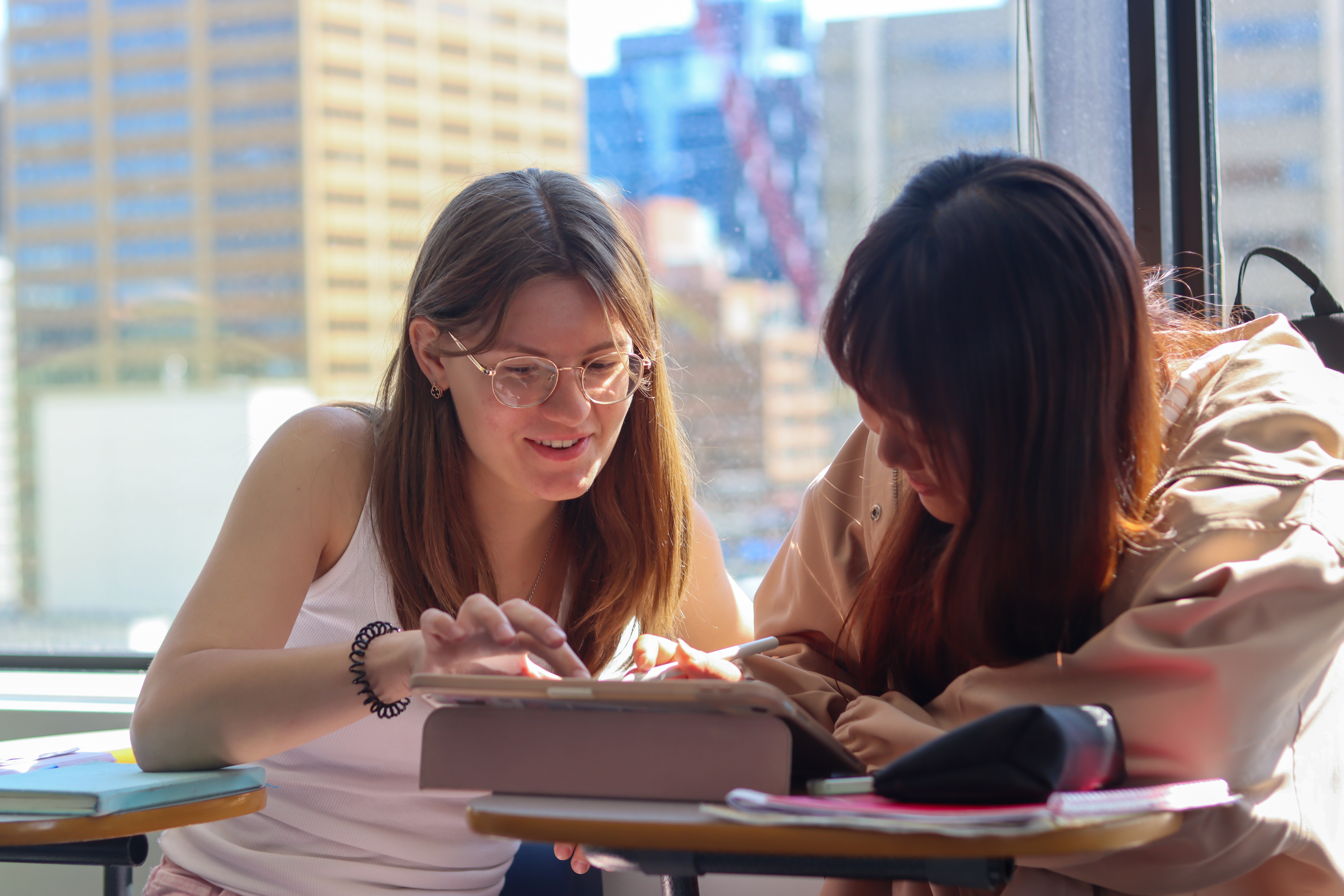 Two students working together at Global Village Calgary
