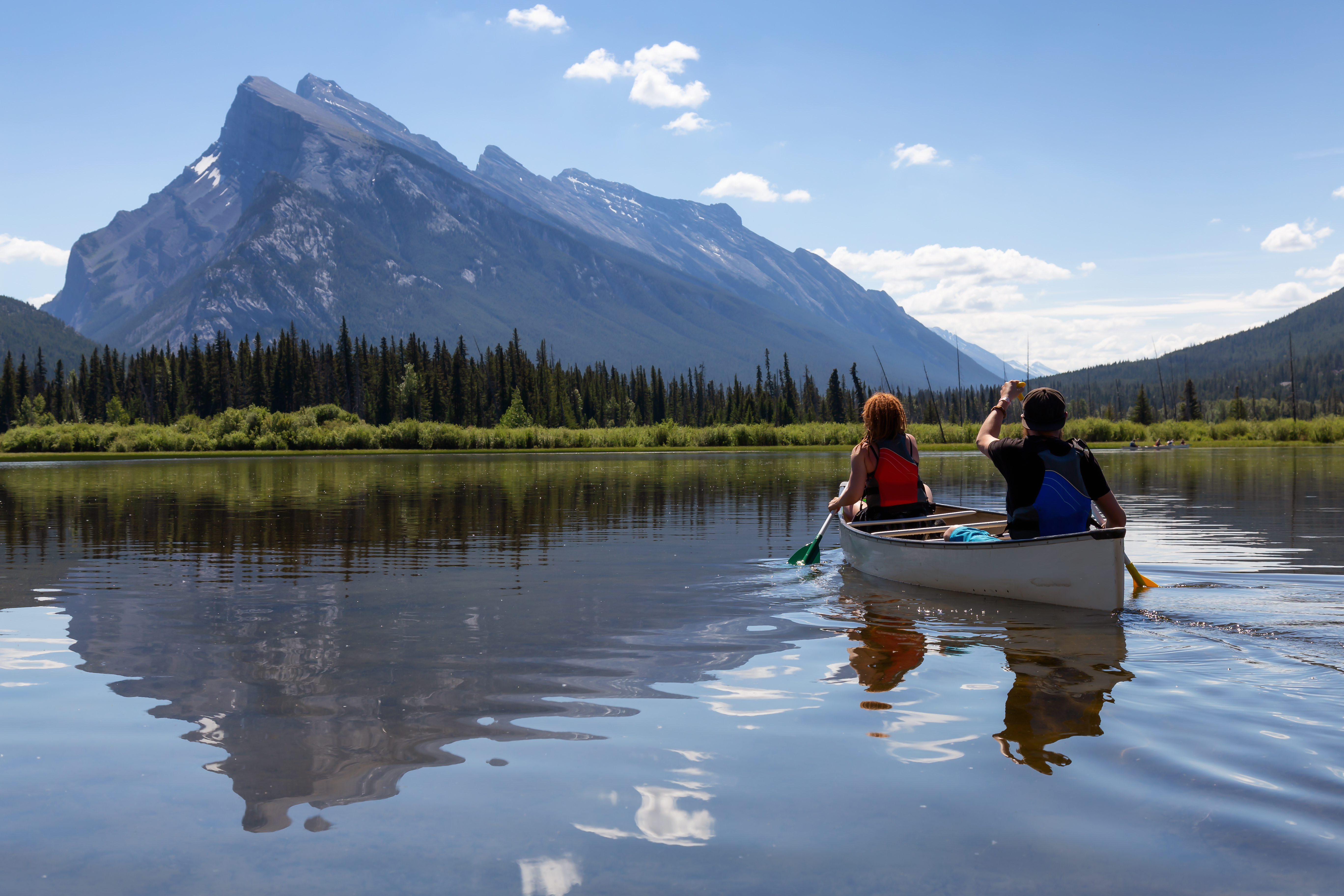 two people in a white canoe