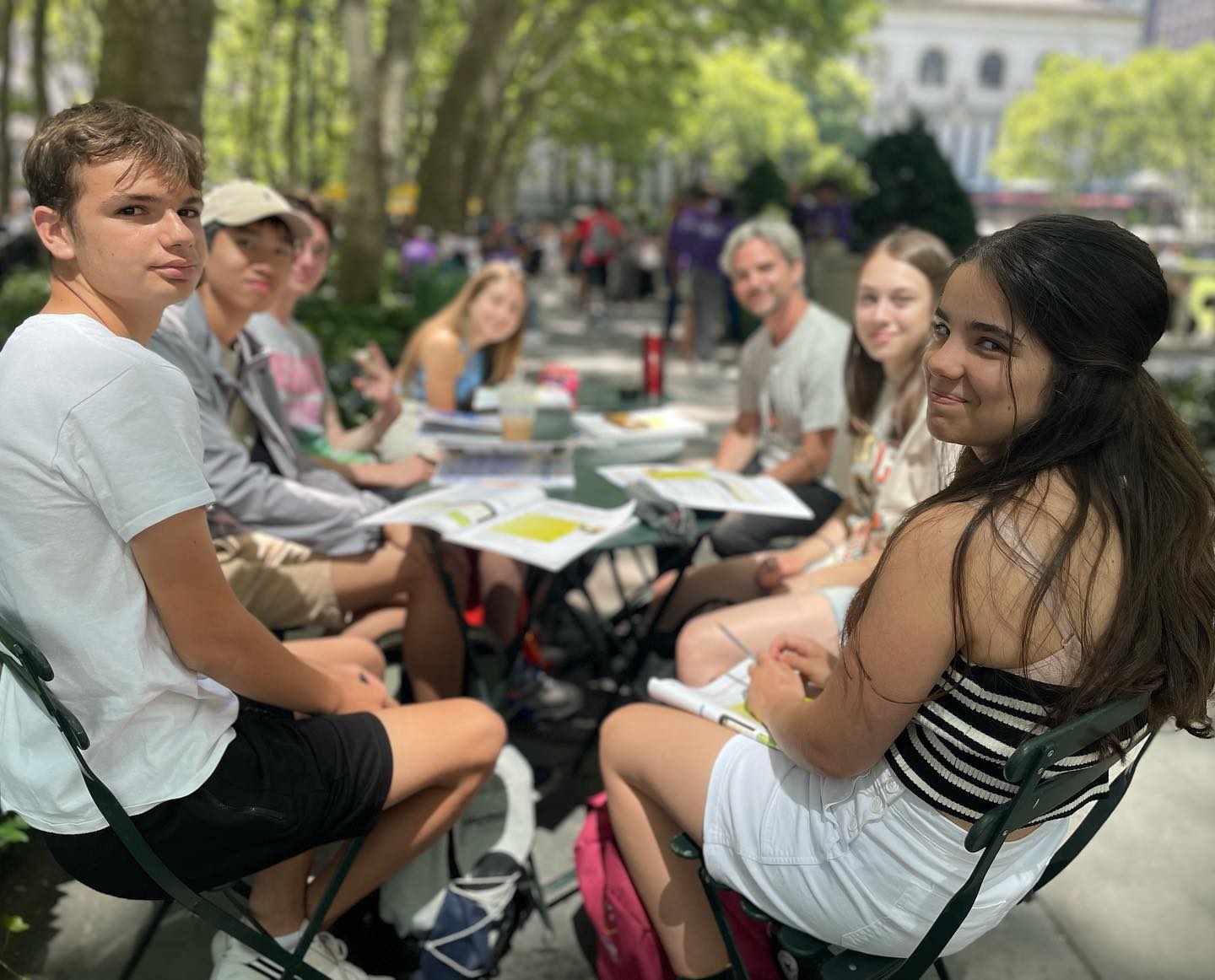 A group of students in class in Bryant Park