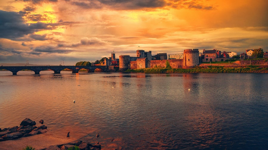 Limerick City Center at sunset featuring the  River Shannon and Thomond Bridge in Ireland