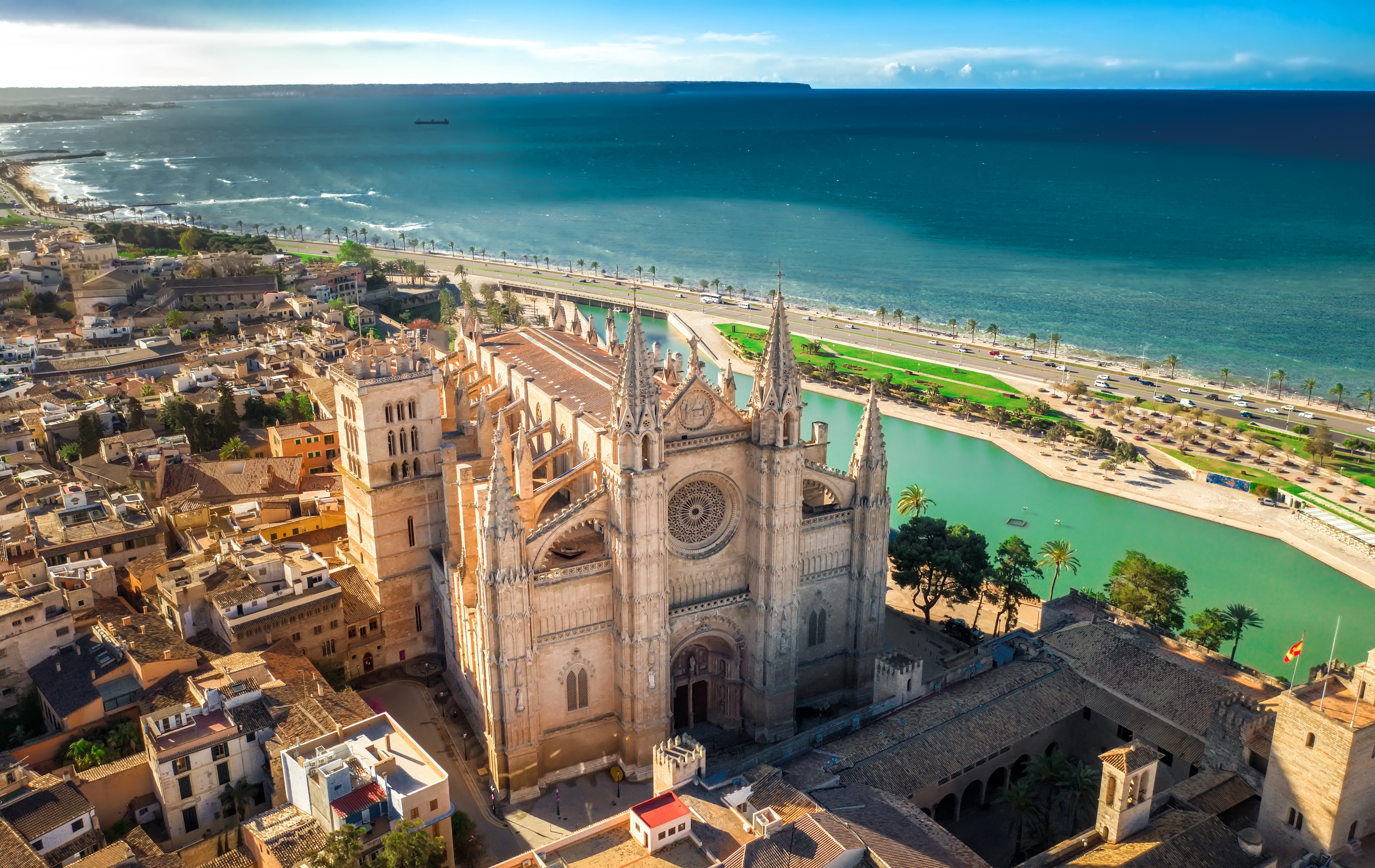 La Seu Cathedral in Palma de Mallorca, Spain, featuring stunning Gothic architecture, intricate details, and vibrant stained-glass windows overlooking the waterfront