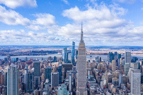 Aerial view of New York City skyline with modern skyscrapers on a sunny day