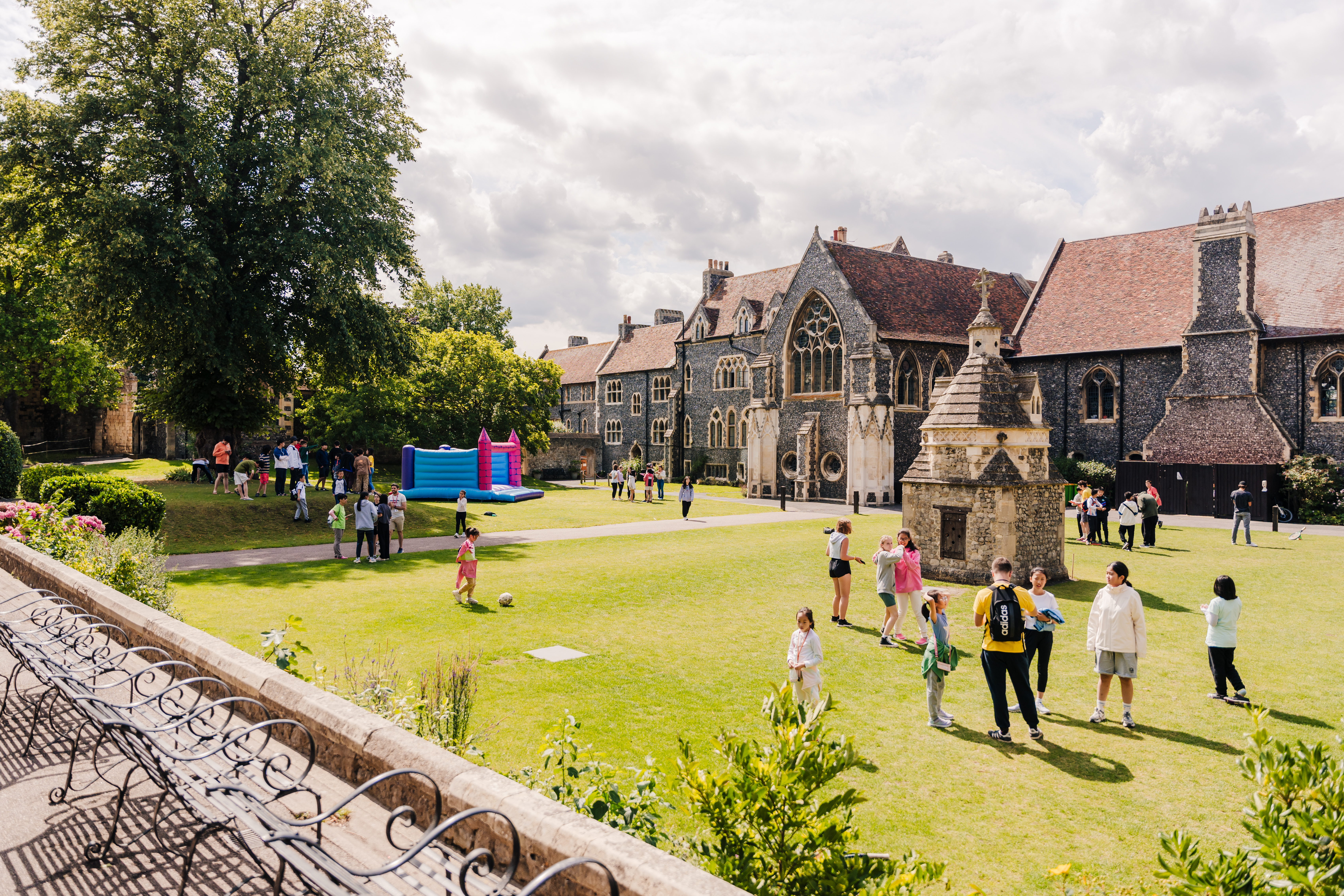 A group of students playing in the lawn at The King's School Campus (8-12)