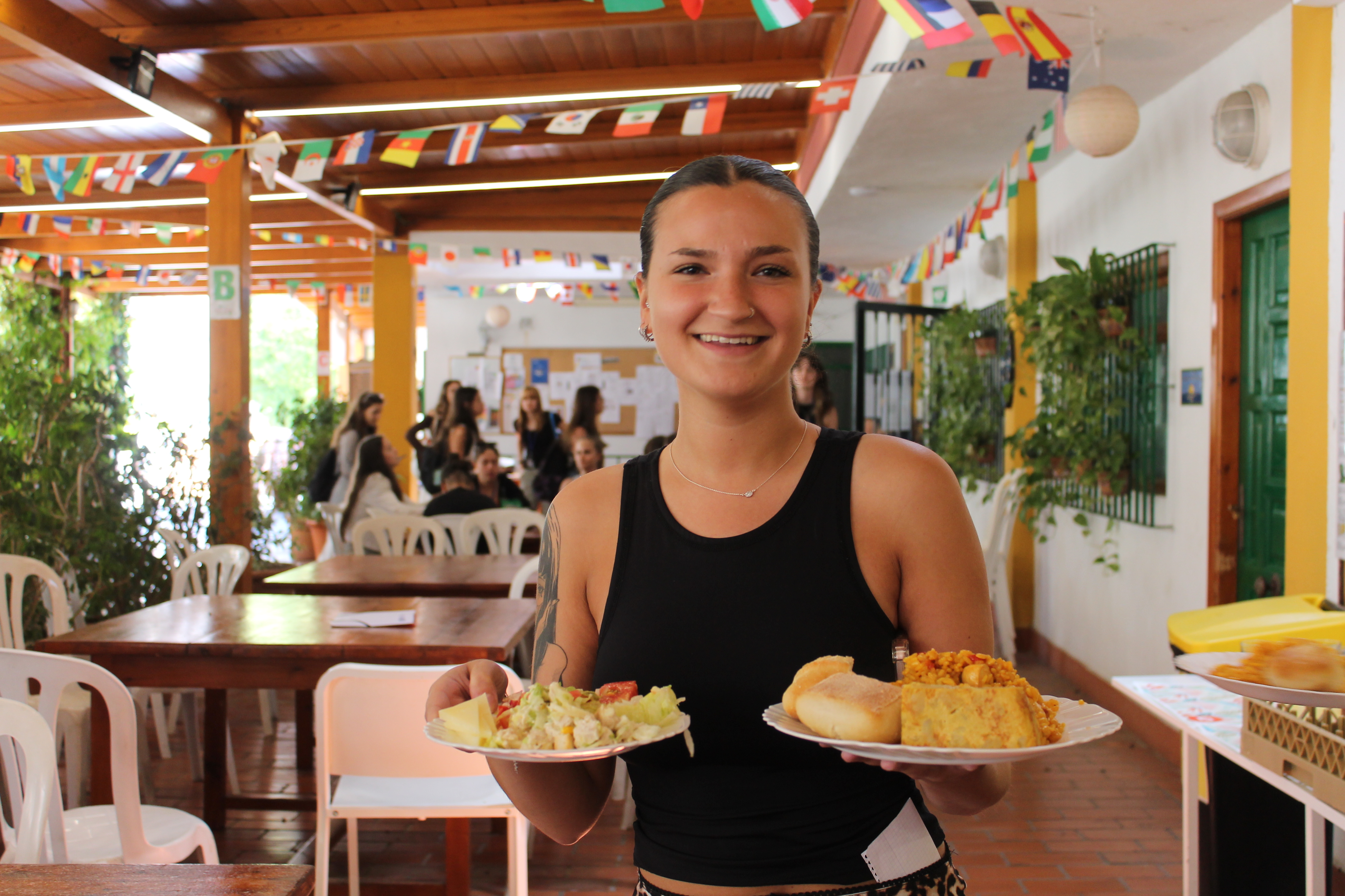 Students having lunch from buffet in Malaga