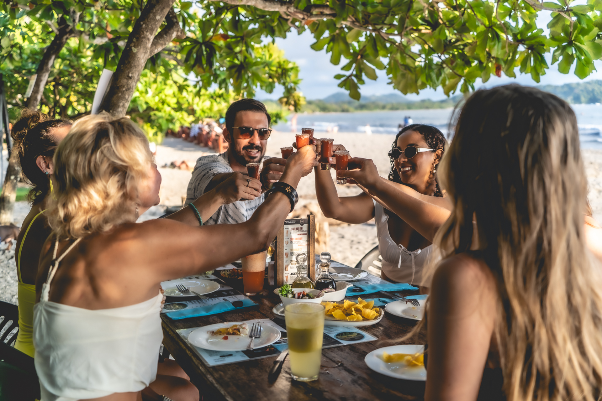 A group of students having lunch at the beach
