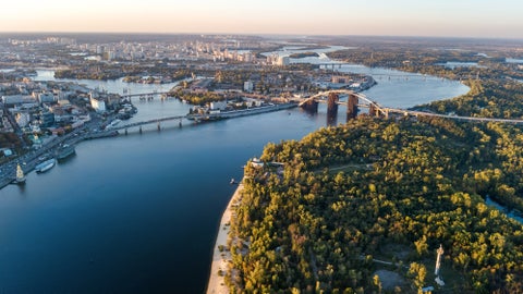 Aerial view of Kiev, Ukraine, featuring the Dnieper River and the Paton Bridge
