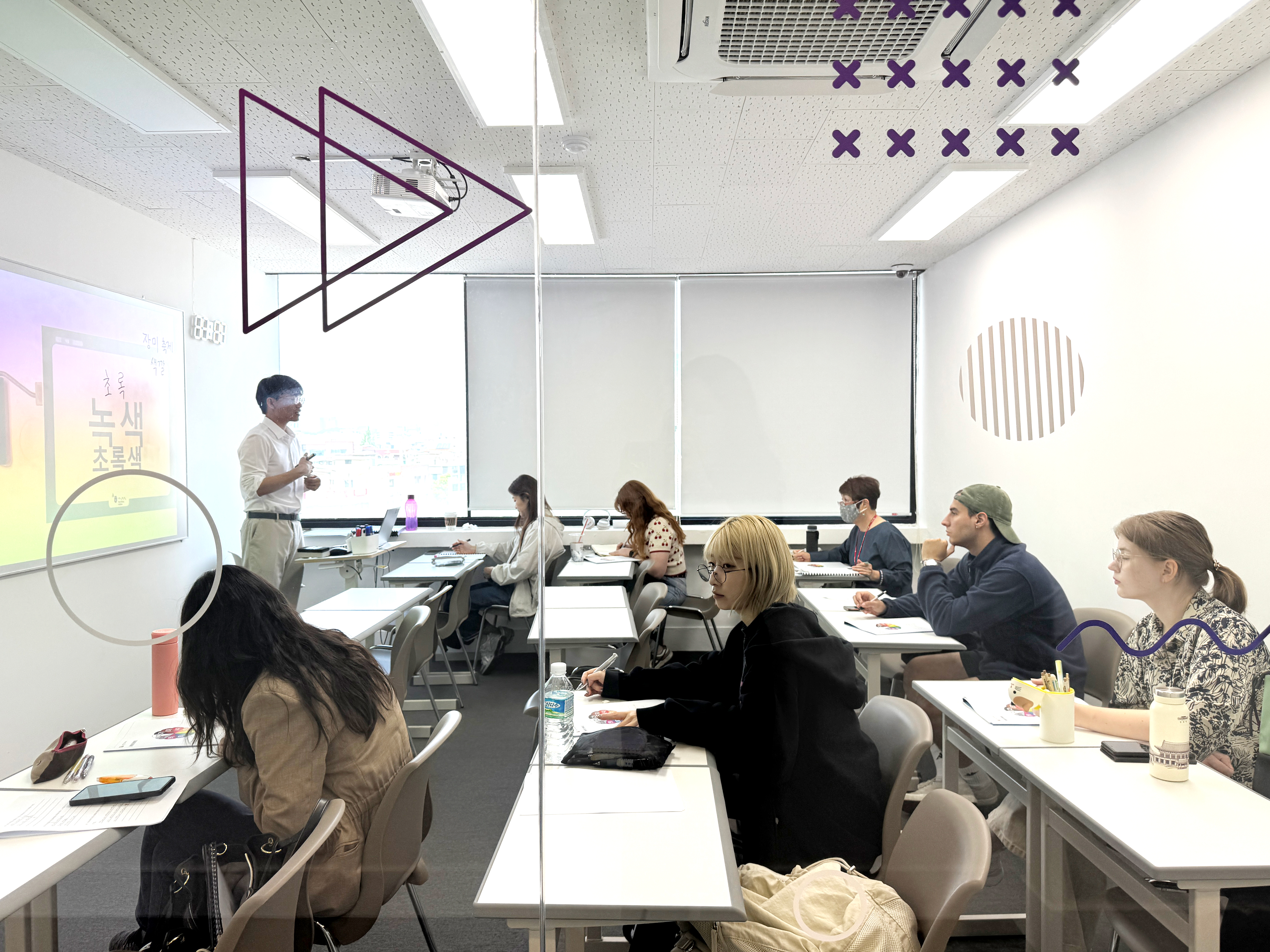 A teacher in front of his students in class