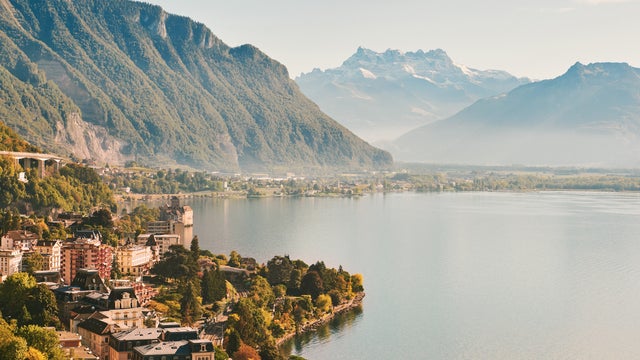 Sunny summer morning view of Montreux city in Switzerland from the embankment along Lake Geneva