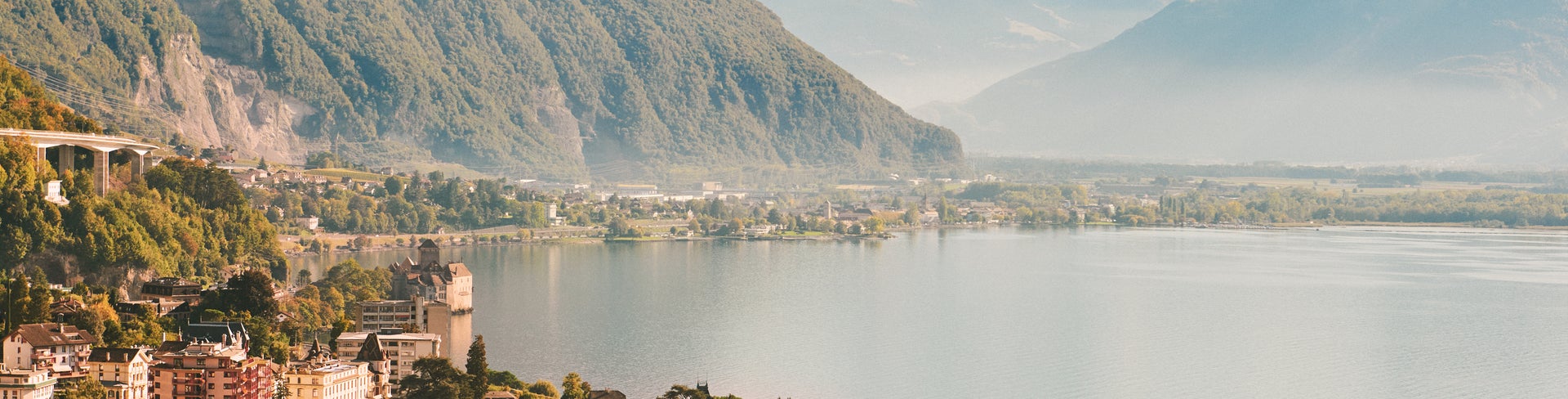 Sunny summer morning view of Montreux city in Switzerland from the embankment along Lake Geneva