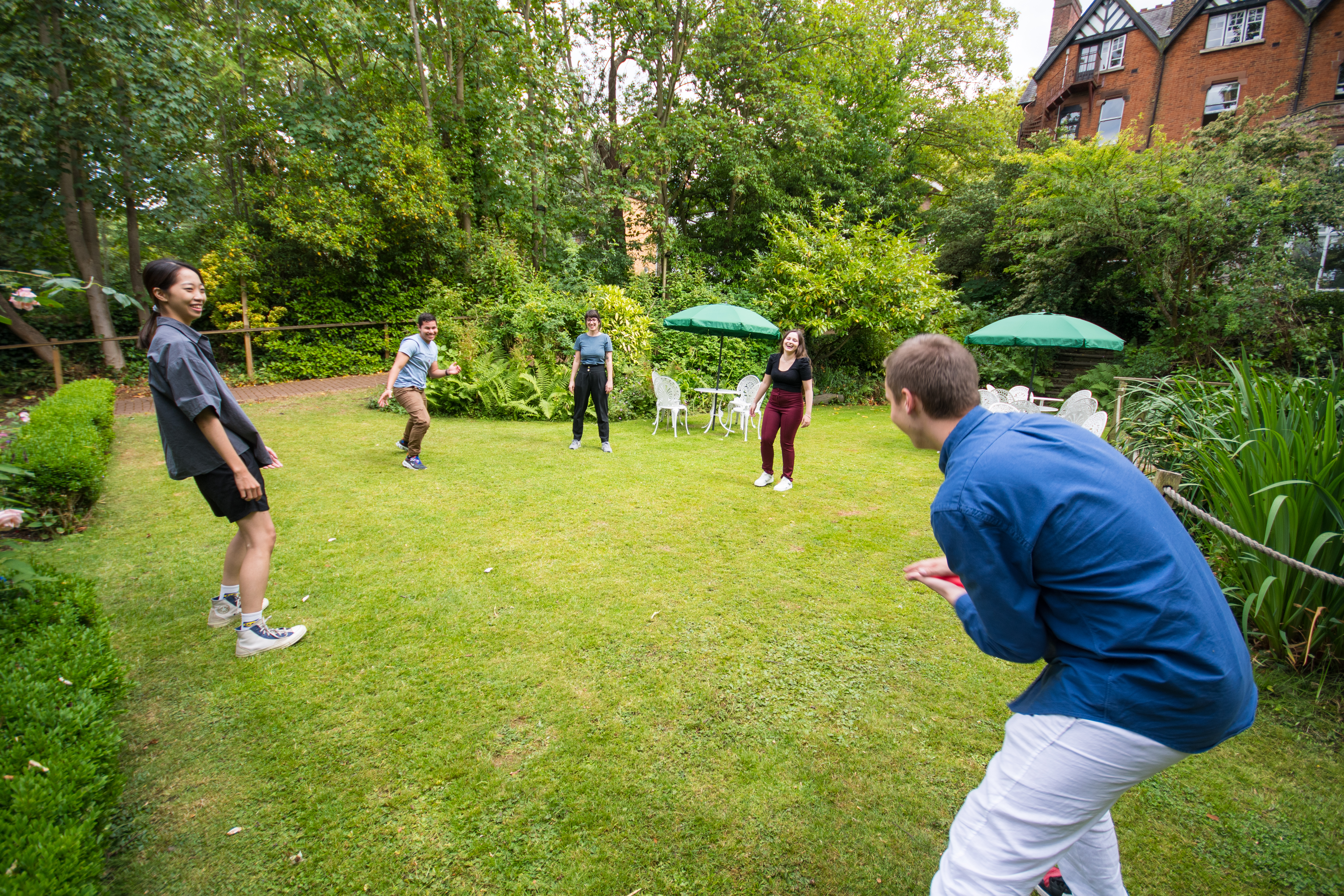 A group of students playing in the garden