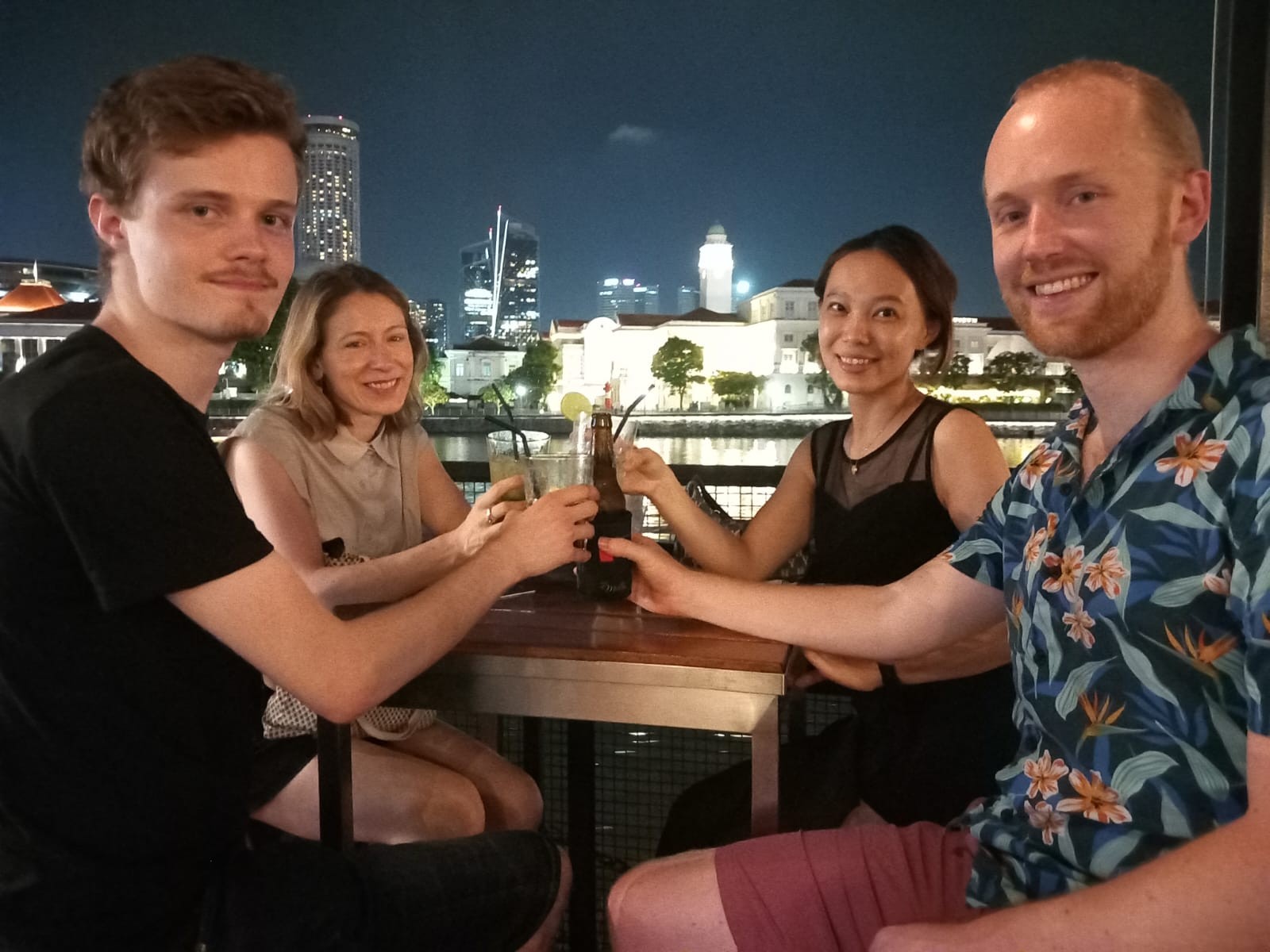 Four students sharing a drink in Singapore