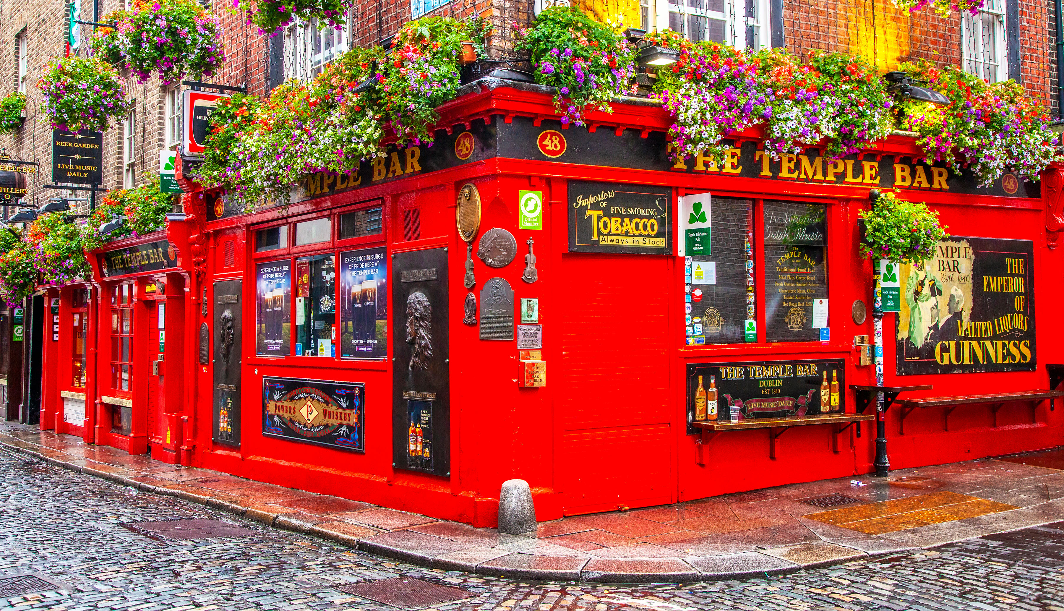 Temple Bar in Dublin, Ireland, featuring its iconic red facade and lively street scene
