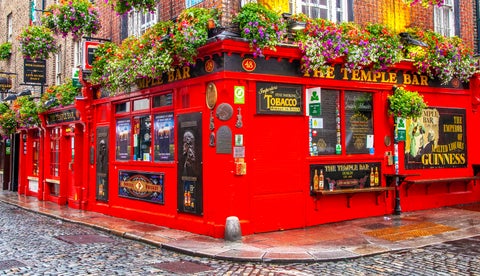 Temple Bar in Dublin, Ireland, featuring its iconic red facade and lively street scene