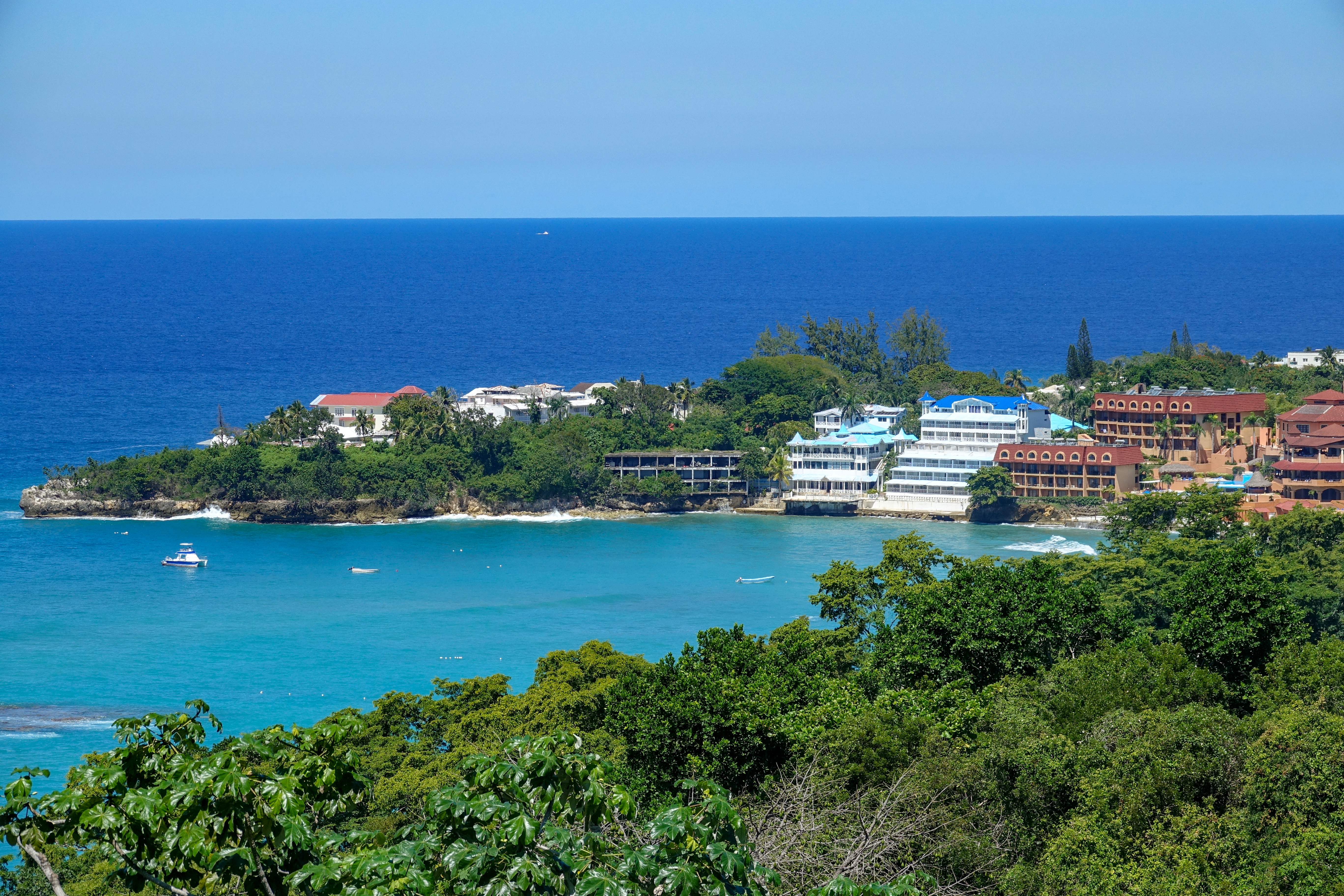 Aerial view of Sosua Beach with vibrant blue ocean, Dominican Republic
