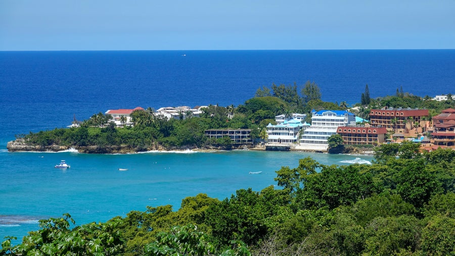 Aerial view of Sosua Beach with vibrant blue ocean, Dominican Republic