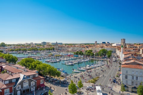 Aerial view of La Rochelle City featuring its Harbour, historic buildings, Ferris Wheels