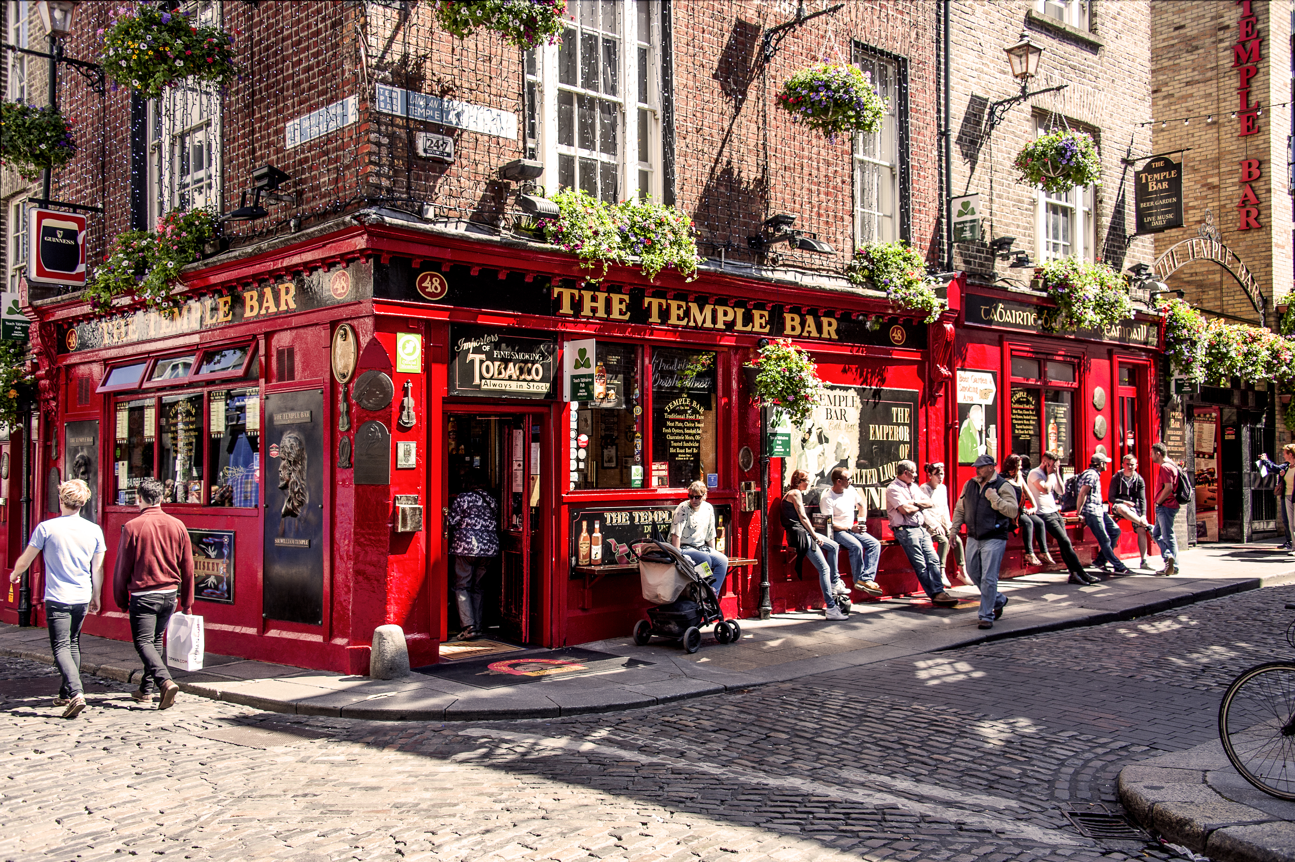 Temple Bar in Dublin, Ireland, featuring its iconic red facade and lively street scene