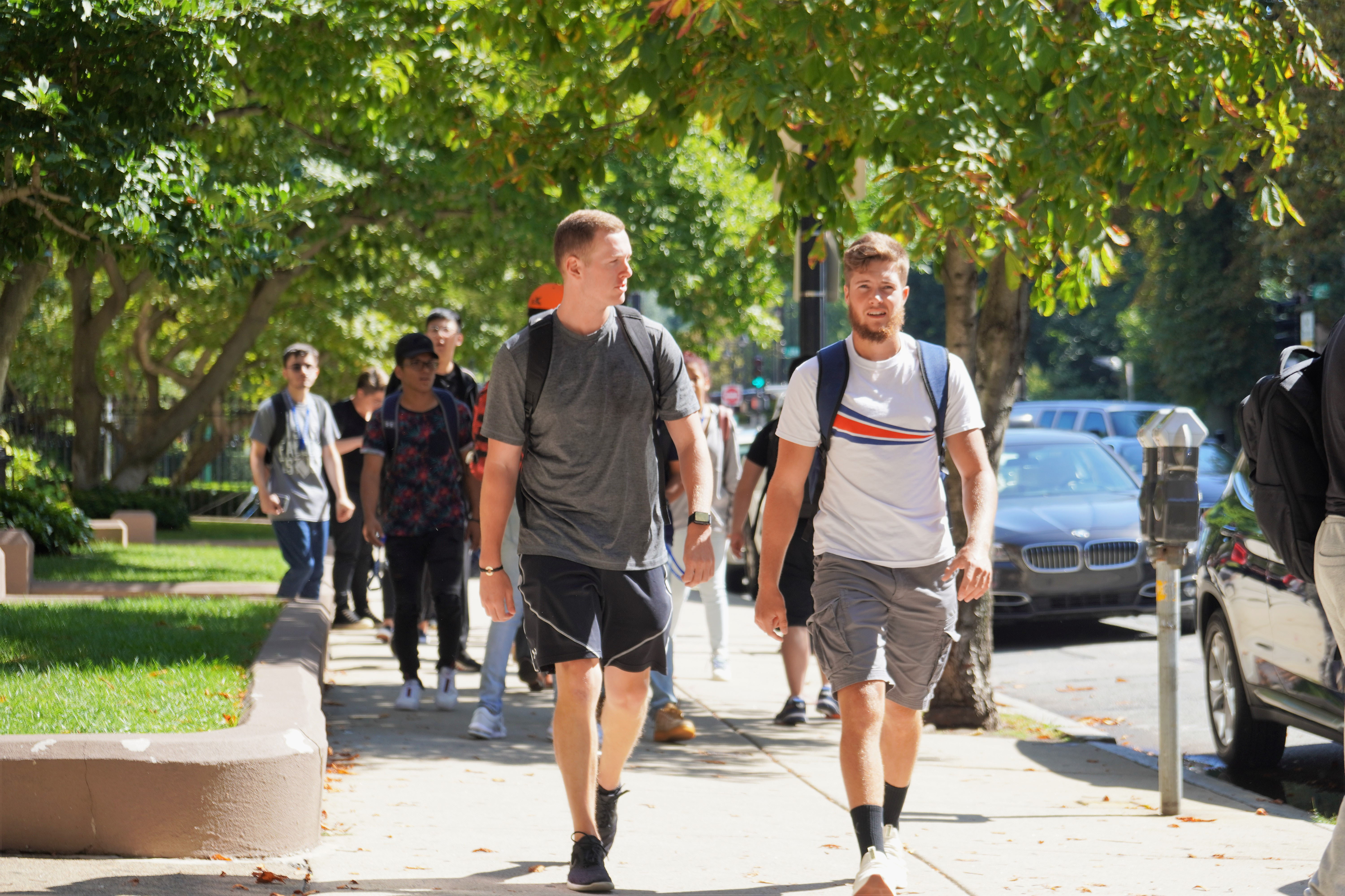 Two students walking through the city