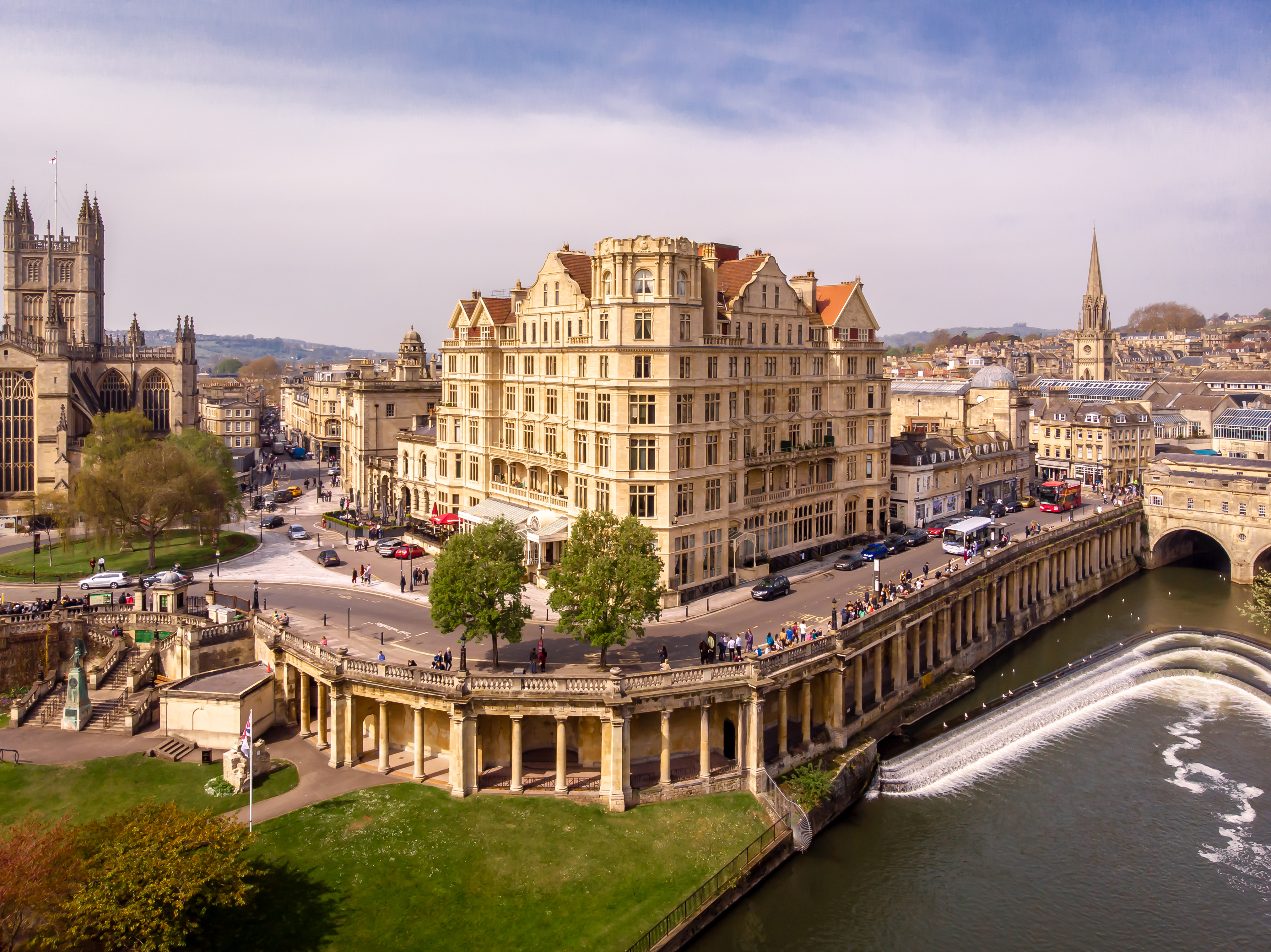 Aerial view of historic buildings and Pulteney Bridge over the River Avon in Bath, UK