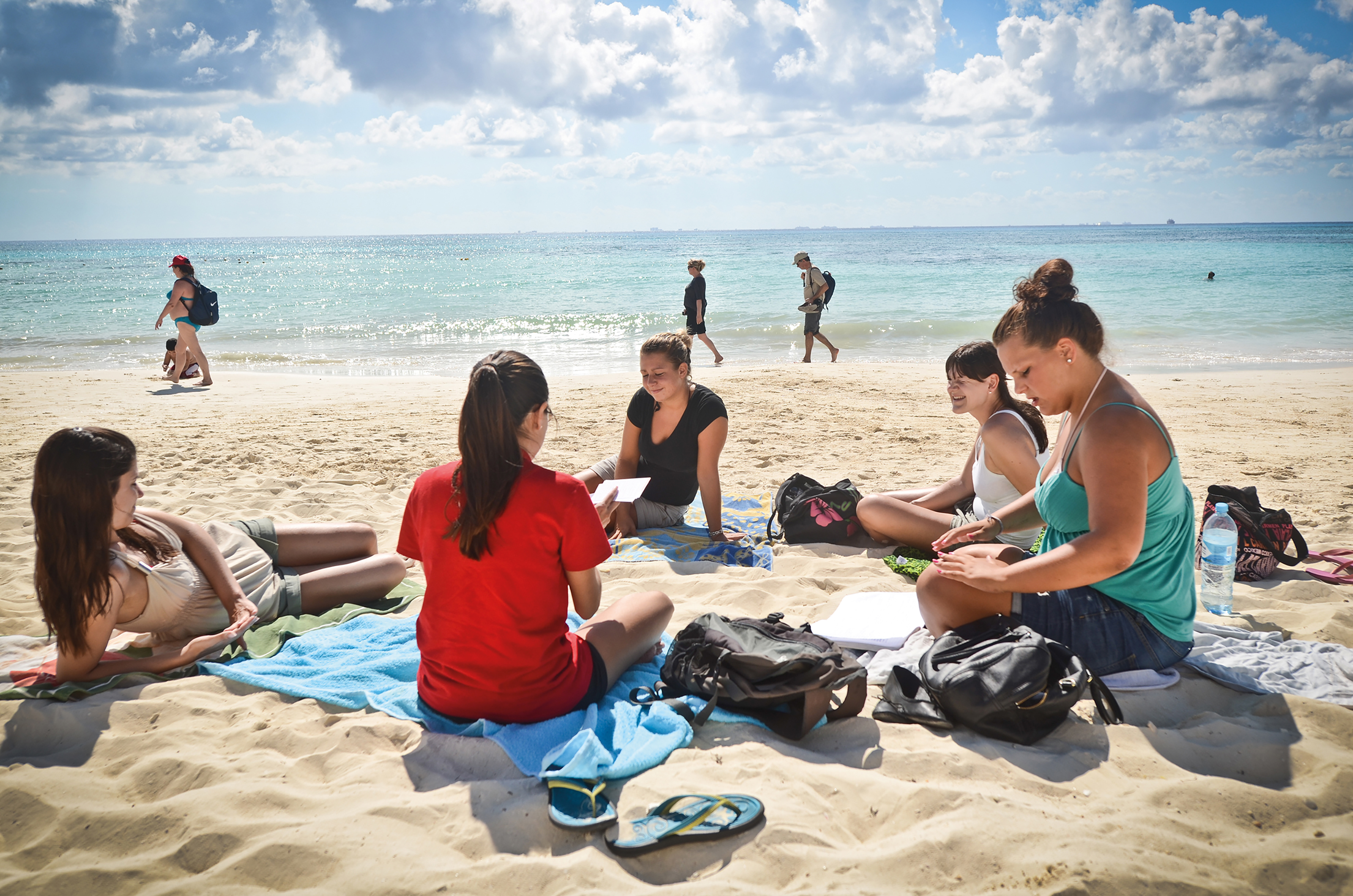 Students studying on the beach at don Quijote Playa del Carmen