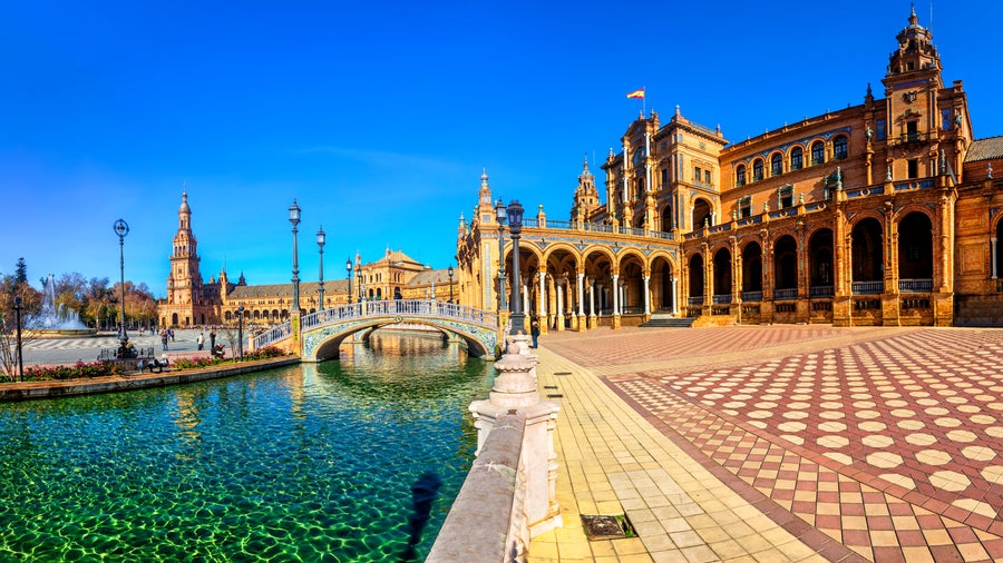 Plaza de España in Seville, Andalusia, Spain, on a bright sunny day with clear blue skies and vibrant architecture