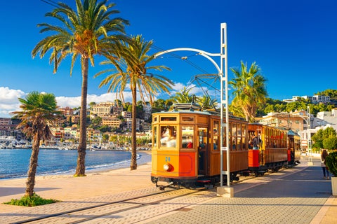 Colorful vintage Tranvía de Sóller tram near the beach in Palma de Mallorca, Spain