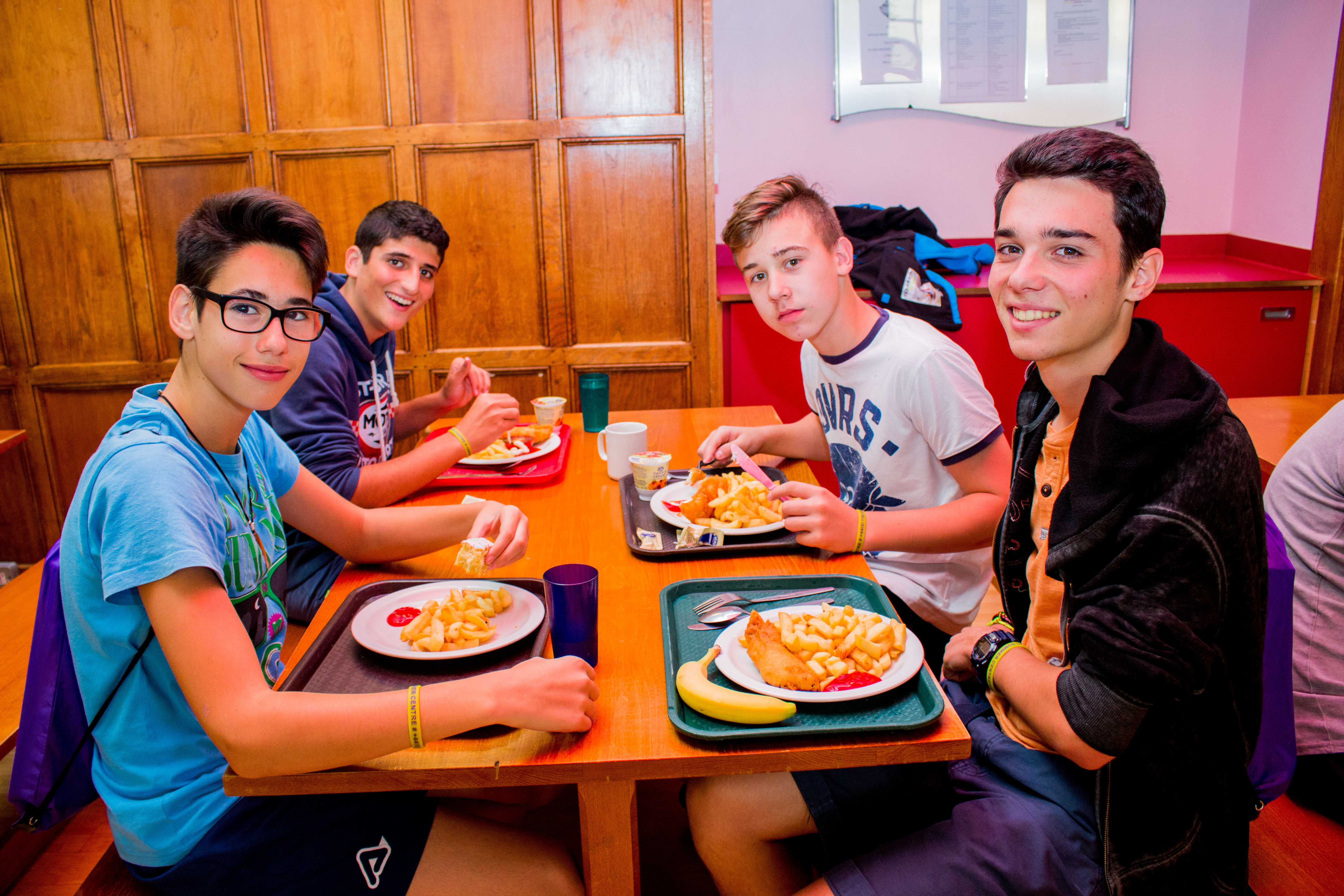 Students having lunch in school cafeteria Hampshire