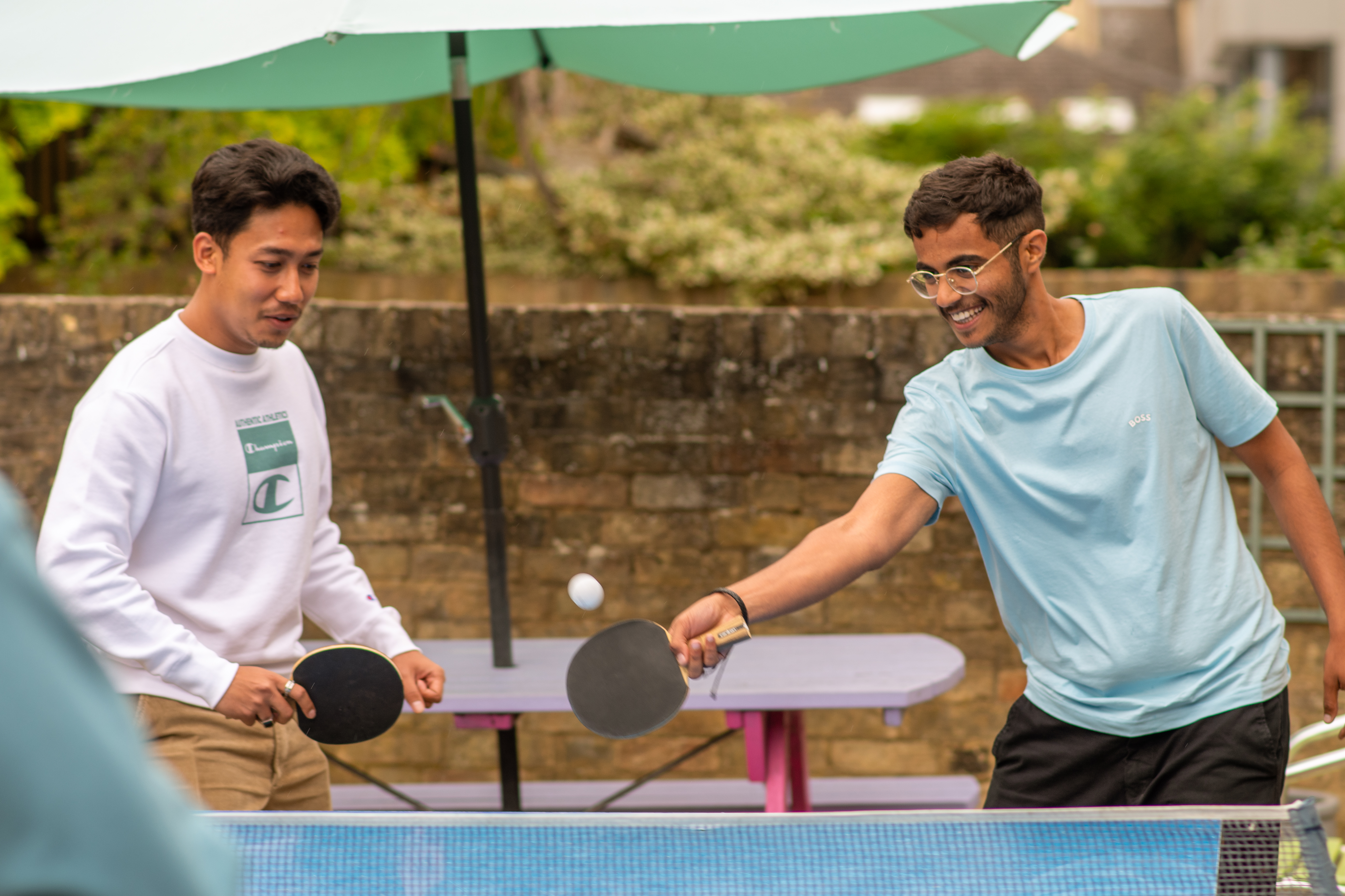 A few students playing ping pong