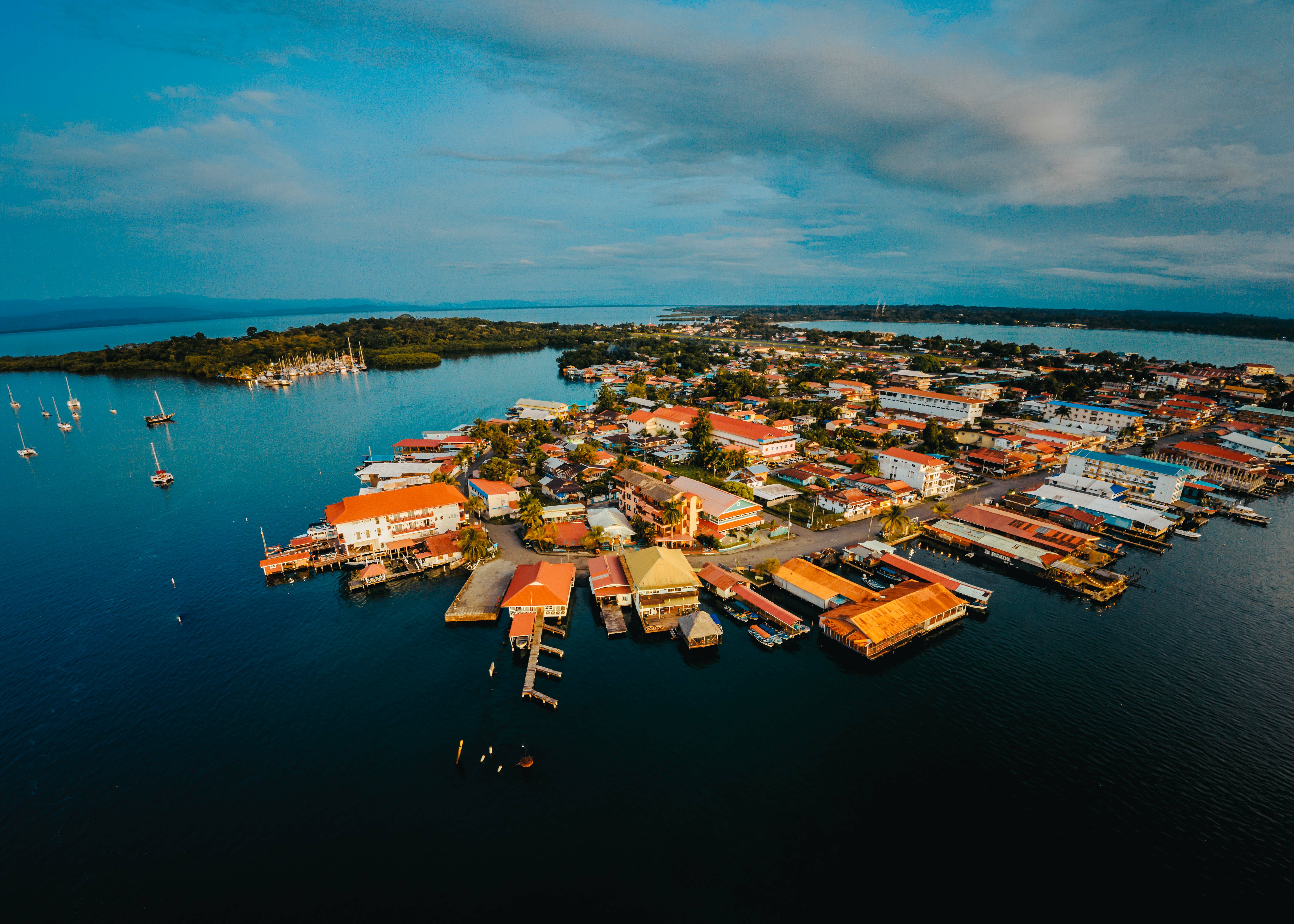 Aerial view of Bocas del Toro, Panama showing boats, typical Caribbean houses, and surrounded by turquoise sea