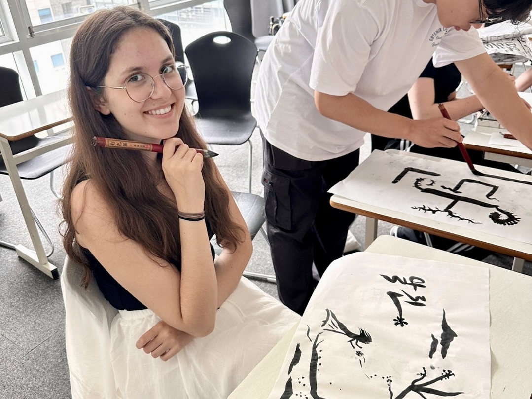 A student practising Korean calligraphy