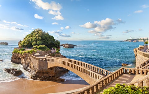 The bridge which connects the mainland to the rocky outcrop of Rocher de la Vierge, where a statue of the Virgin Mary stands in Biarritz, France,