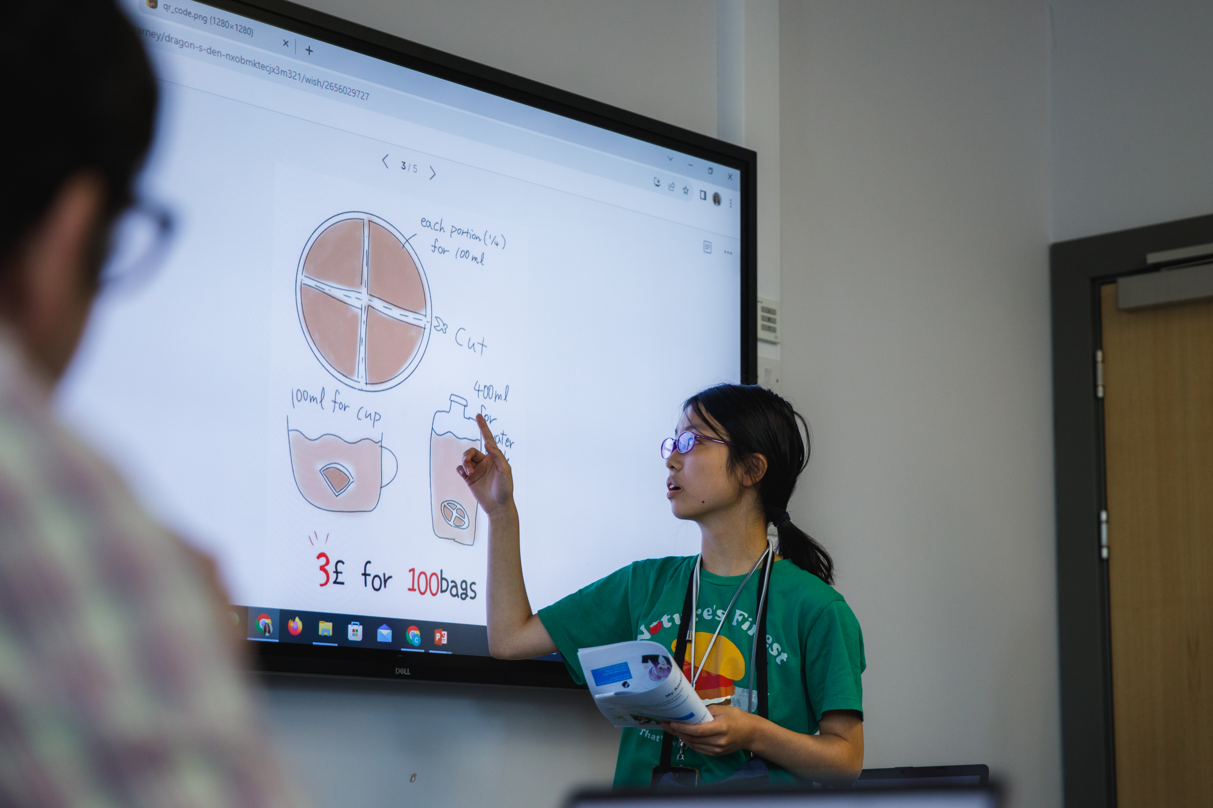 School clasroom with student at board