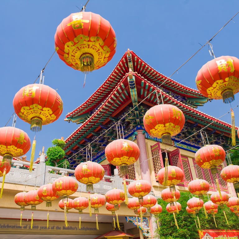 Classic decorative elements with Wat Phra Thong temple in the background, Phuket, Thailand