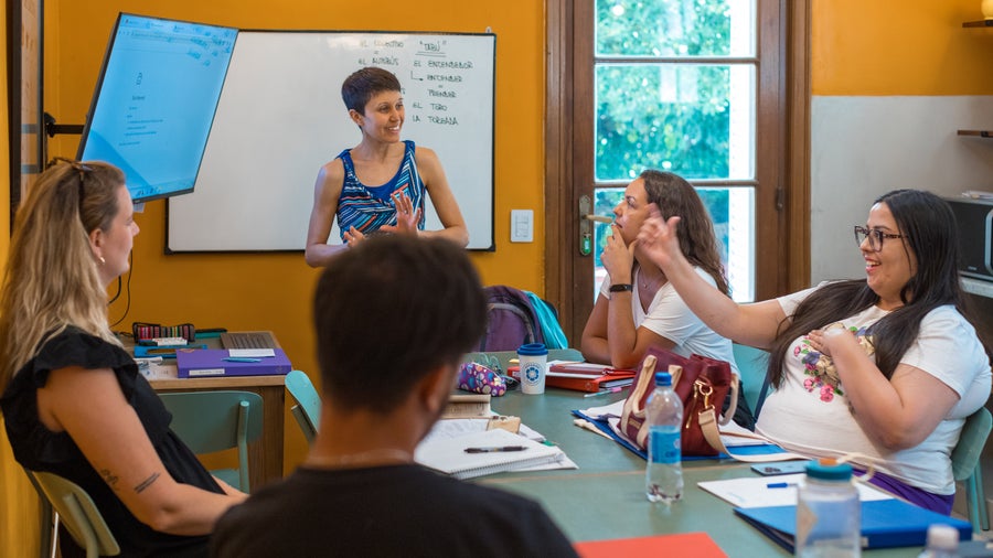 A teacher explaining a lesson to her students