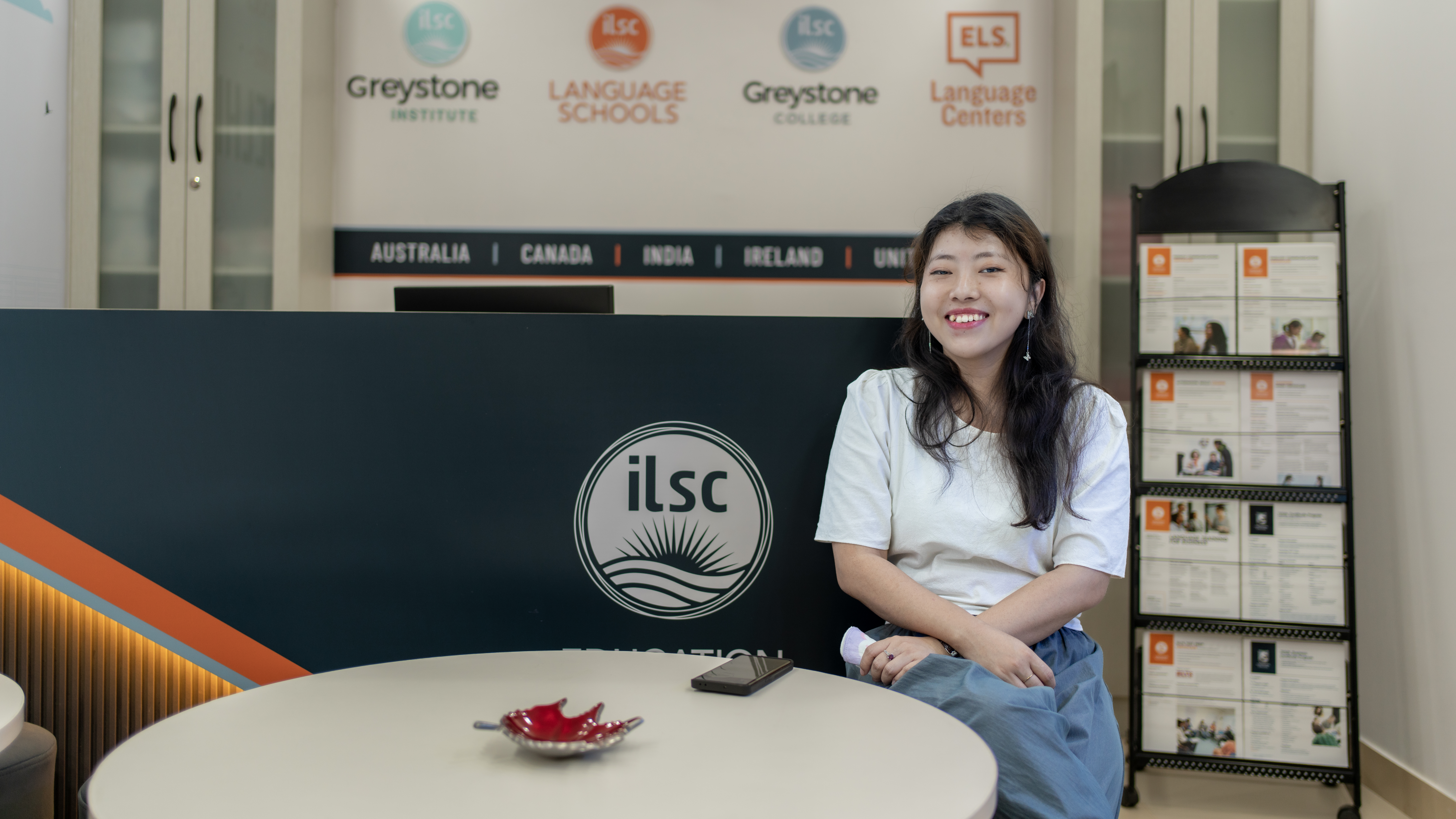 A student sitting by the reception at ILSC New Delhi