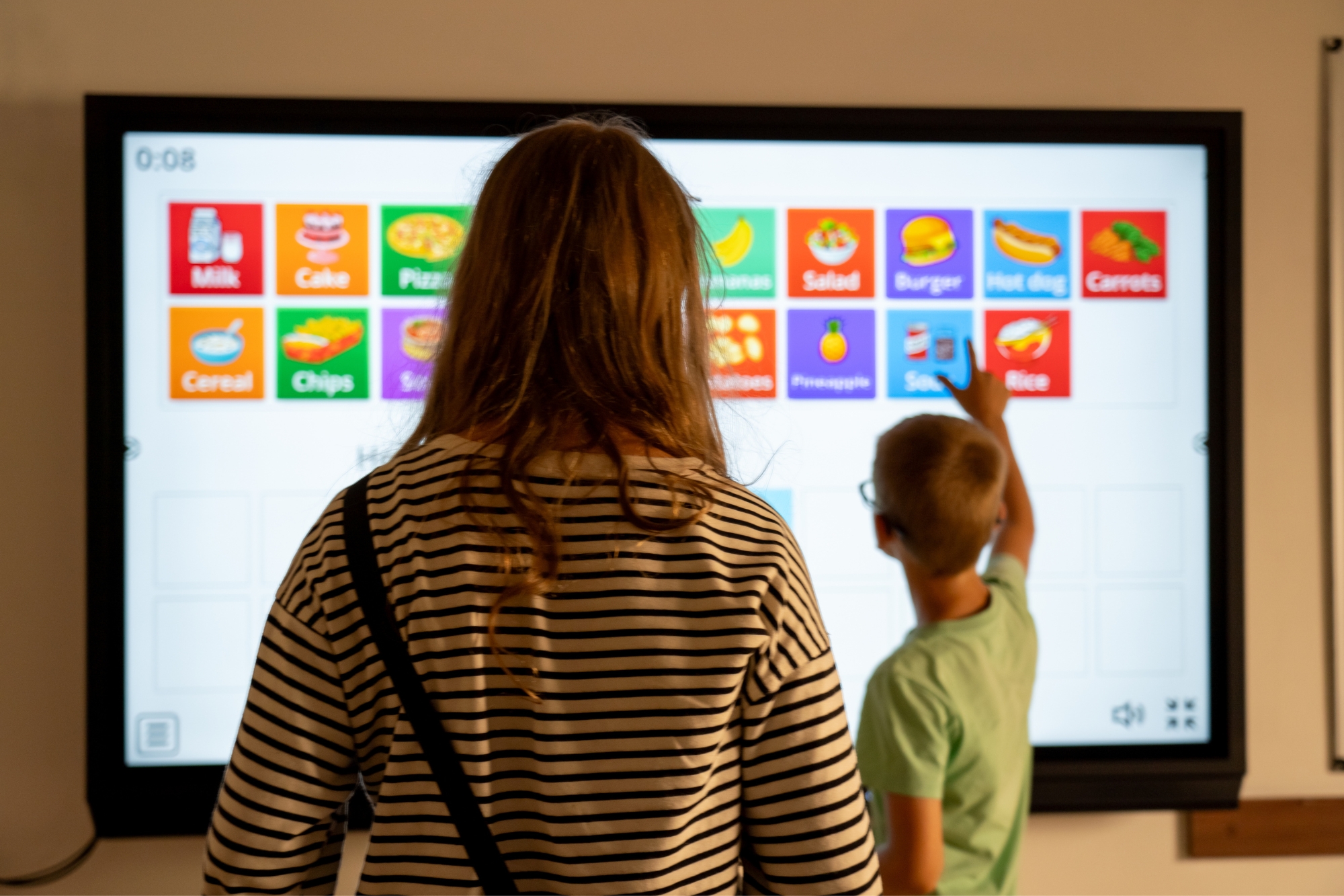 Students in class with virtual board