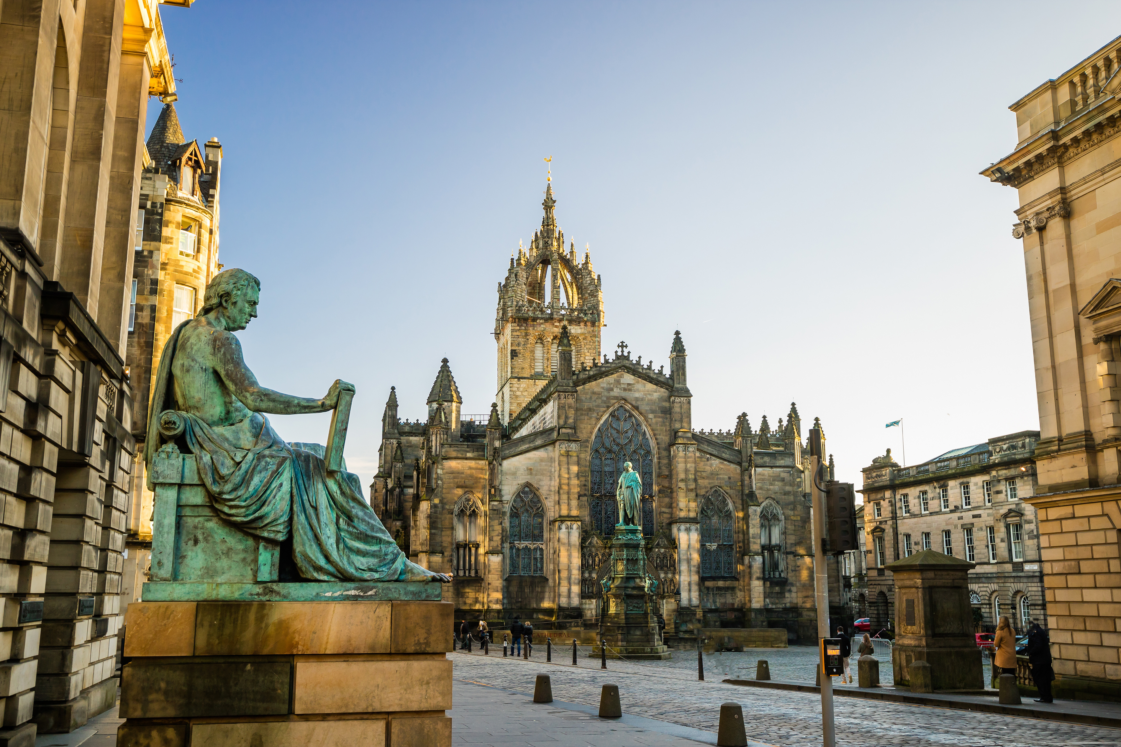 St Giles’ Cathedral with crown spire and Adam Smith statue in Parliament Square, Edinburgh Old Town