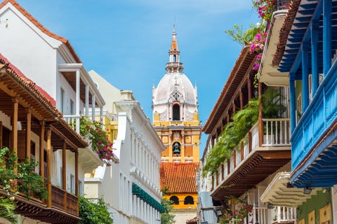 City center of Cartagena, Colombia, with colorful buildings and the yellow Catedral de Santa Catalina de Alejandría in the background