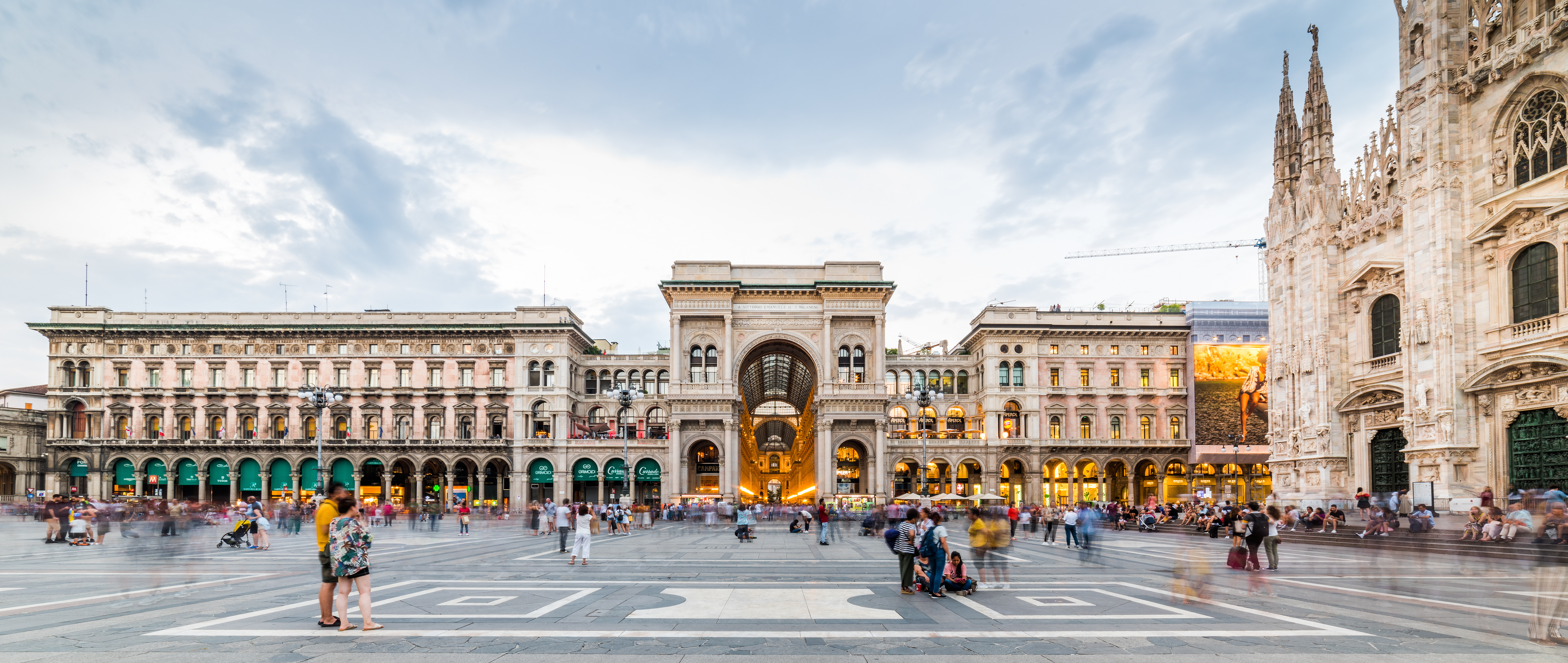 Panoramic view of Duomo Square featuring  Duomo di Milano Cathedral and Galleria Vittorio Emanuele II in Milano, Italy