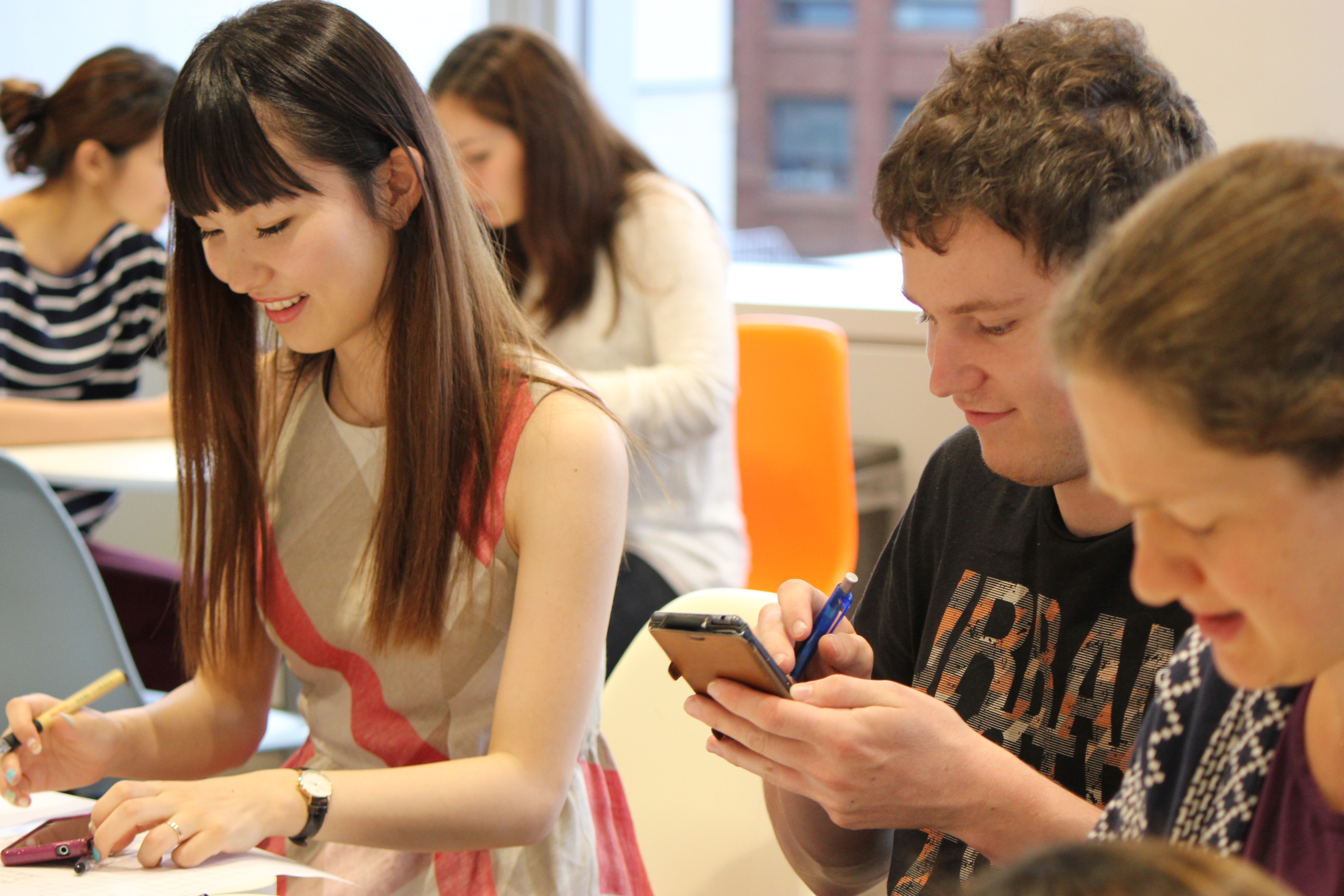 A few students doing an activity in class at Lexis Kobe