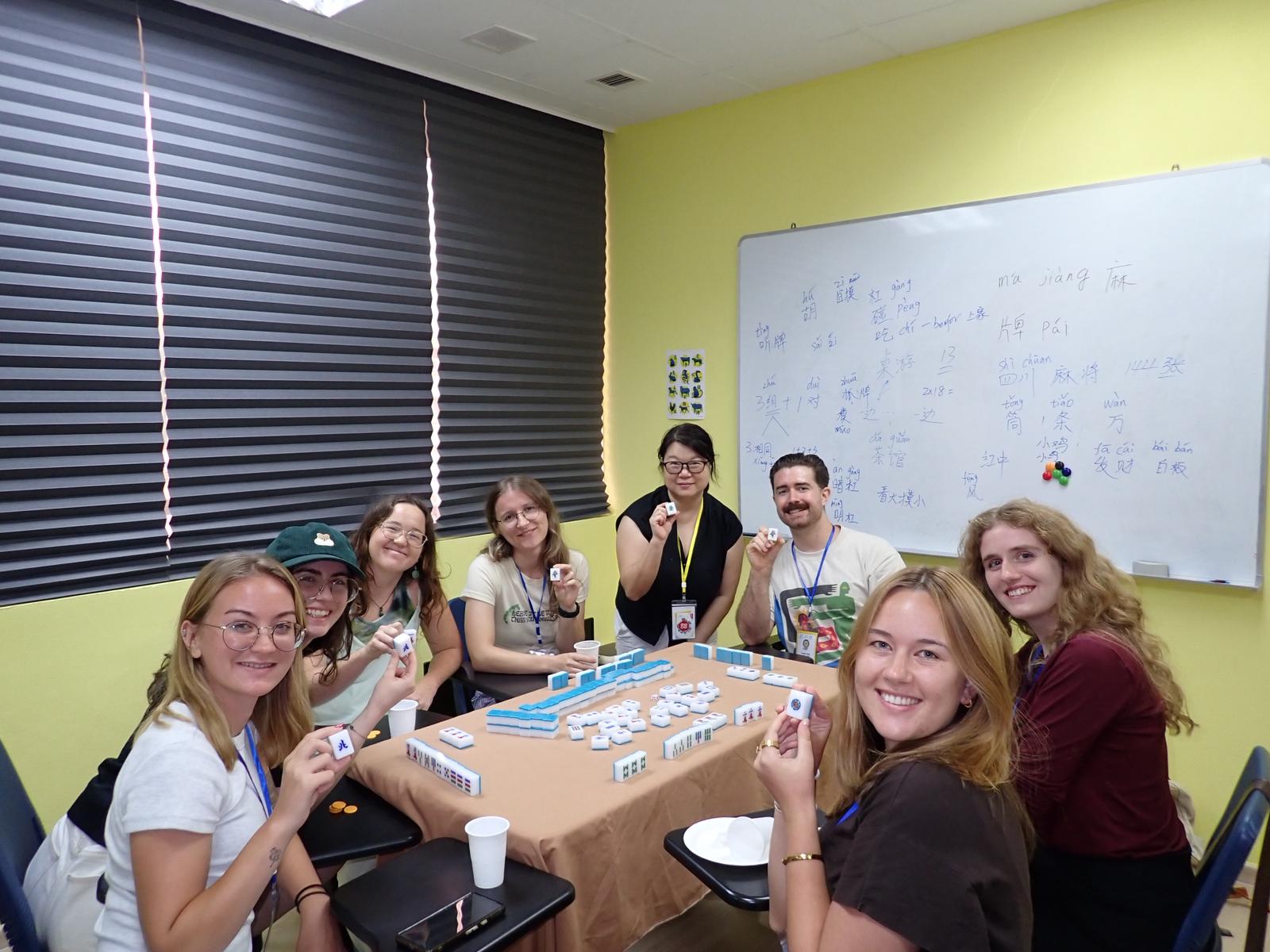 A group of students playing Mahjong