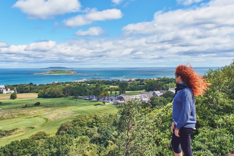 Student watching the views of Dublin, Ireland, captures her standing against a backdrop of the cityscape