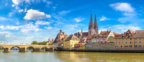 Regensburg Historic City Center featuring Stone Bridge (Steinerne Brücke) with Regensburg Cathedral (Dom St. Peter) in the background, Germany