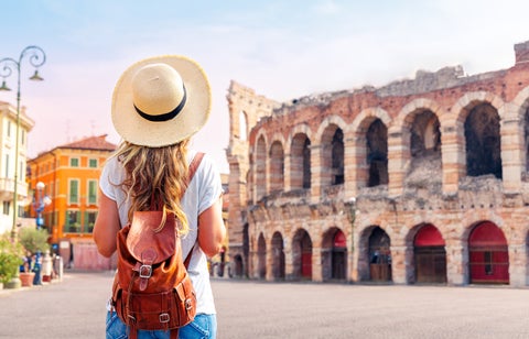Tourist looking the Arena di Verona, roman amphitheater, in Verona, Italy