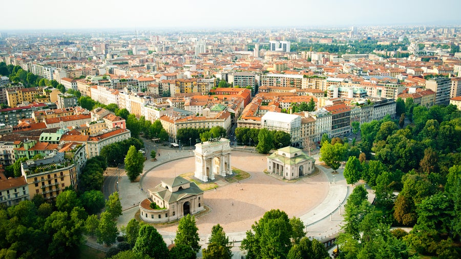 Aerial view of f Milan with its blend of historic and modern architecture, featuring iconic landmarks like the Duomo di Milano