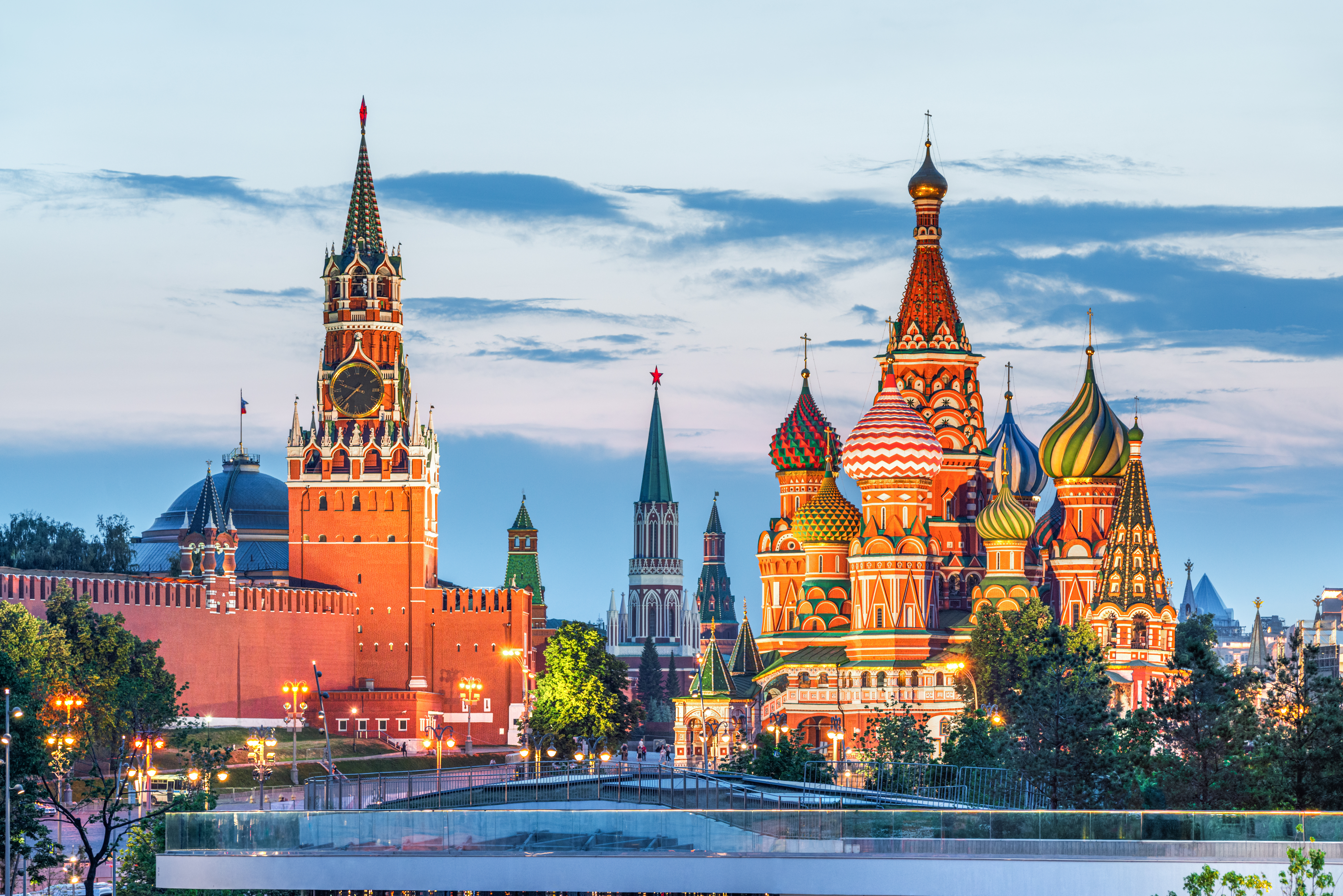 Colourful domes of St. Basil's Cathedral with the historic GUM Department Store next to it in Moscow, Russia