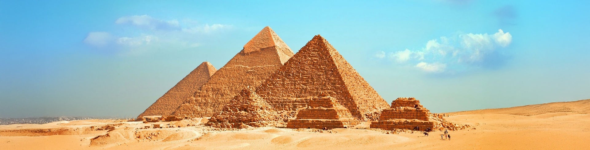 Ancient Egyptian pyramids of Giza in Cairo under a sunny sky