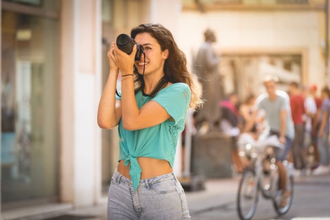 Tourist taking a photo at Verona, Italy