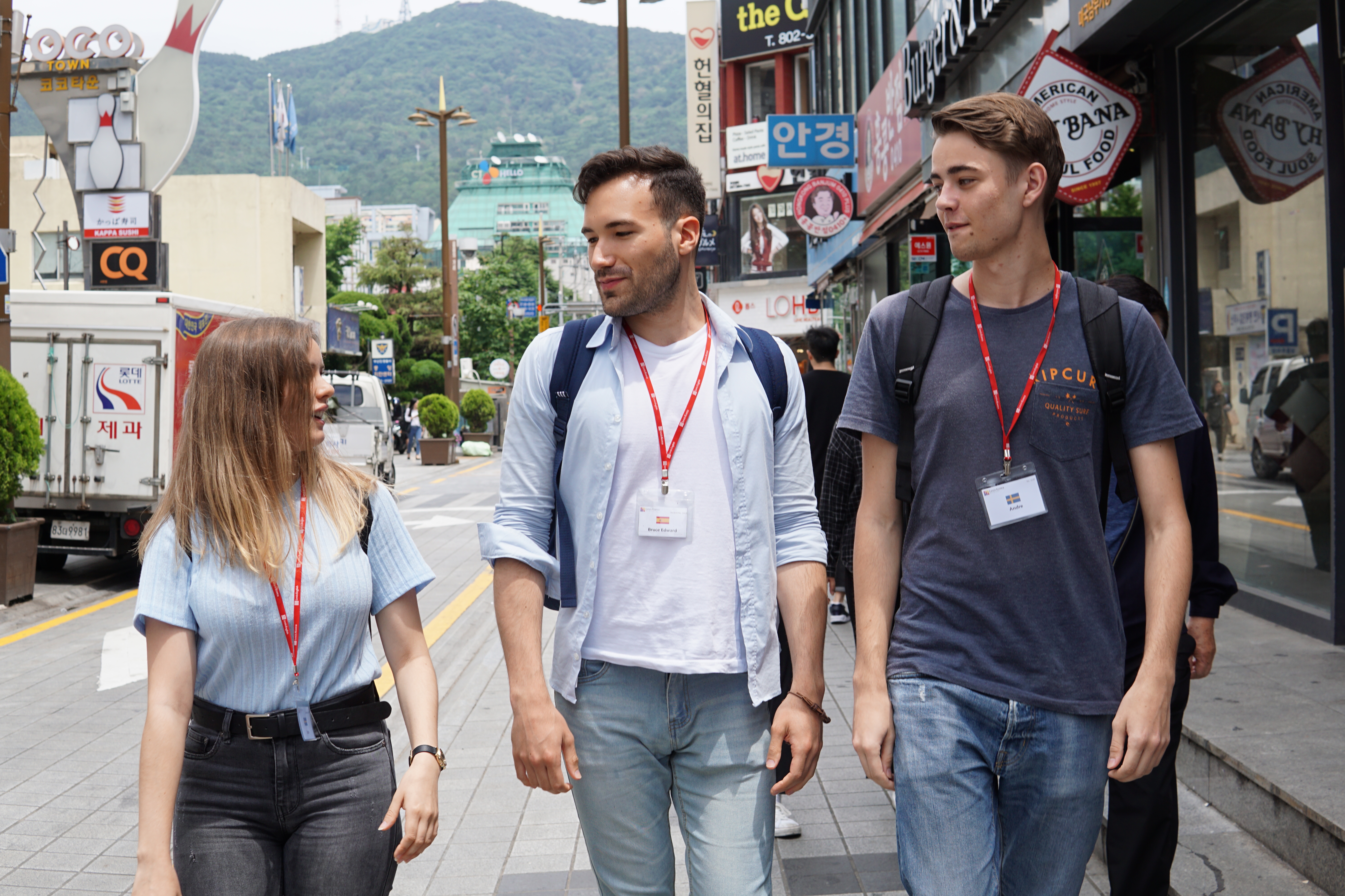 Three students walking around Busan
